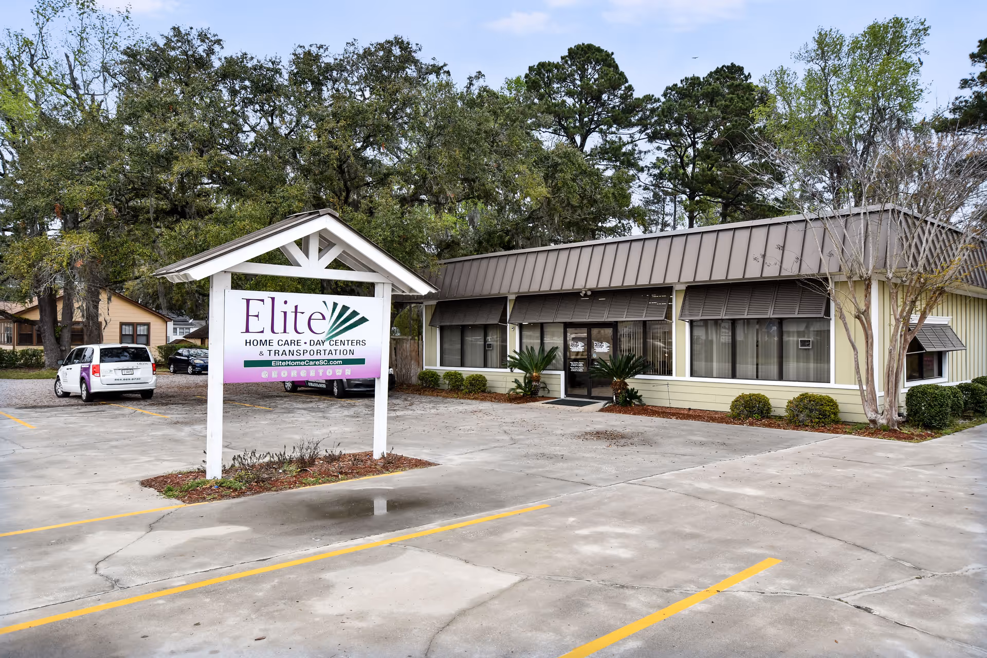 Single-story senior care facility with an Elite sign in the parking lot.