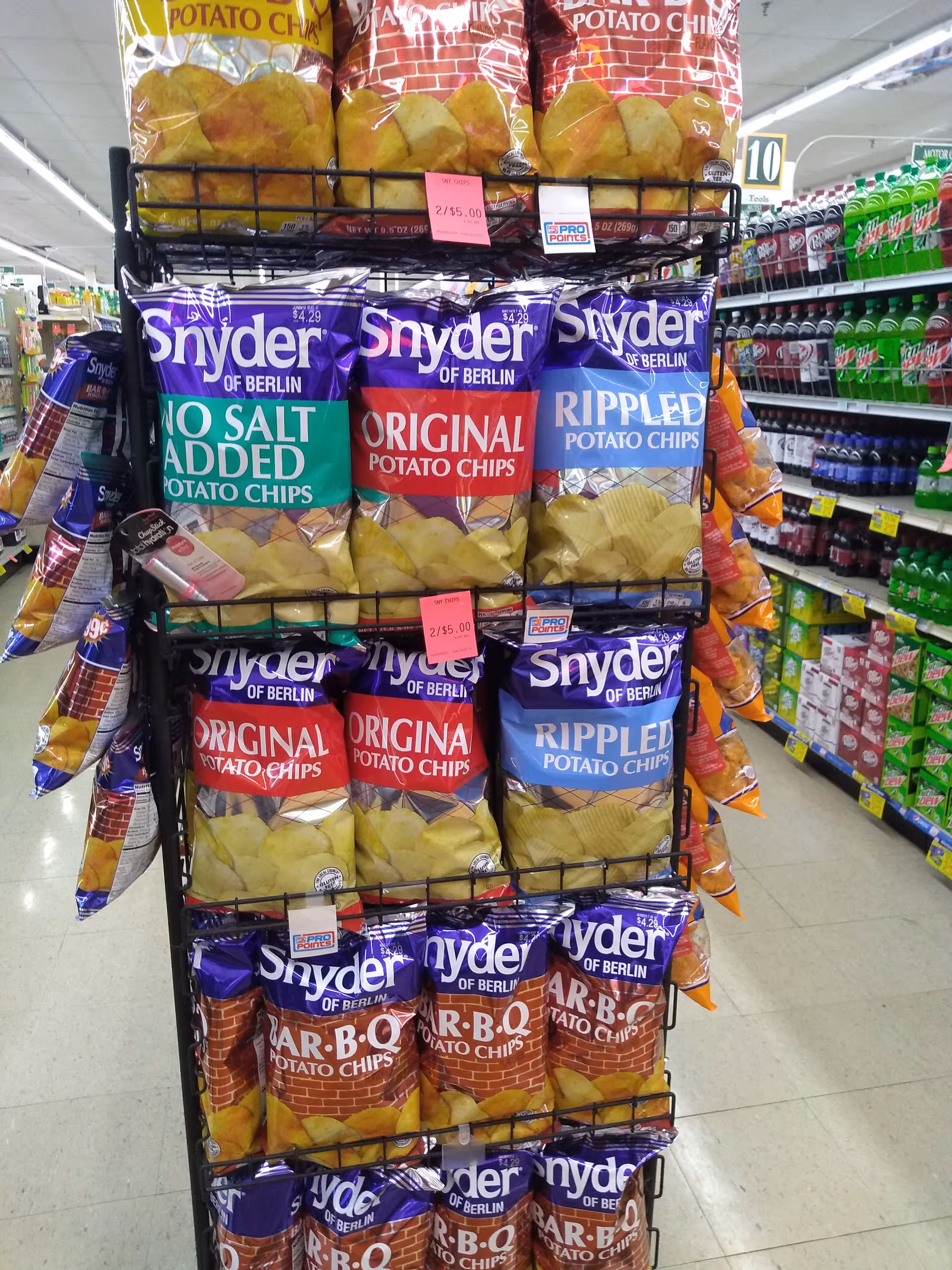 Display rack of Snyder of Berlin potato chips in a grocery store aisle