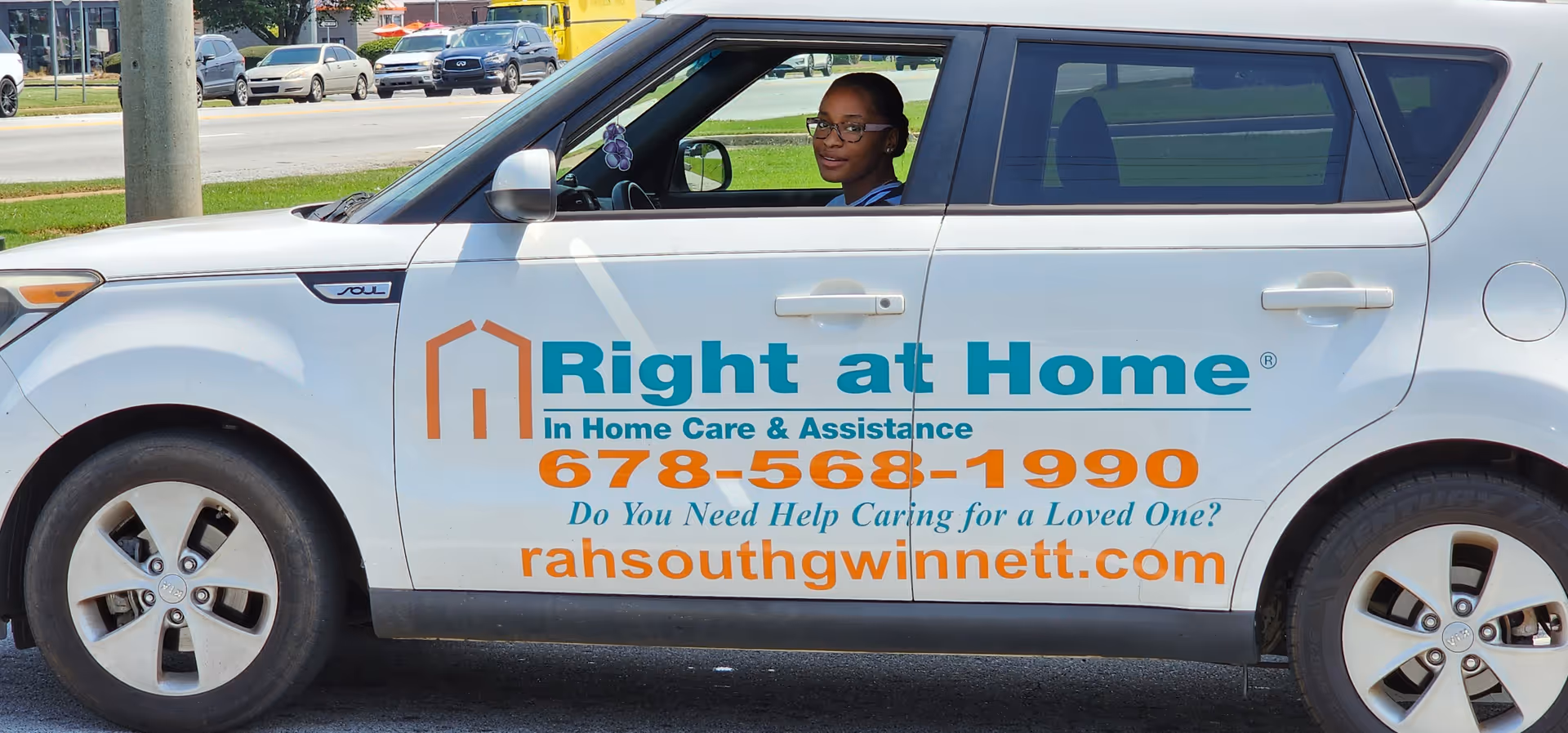 White van with Right at Home branding and phone number parked outdoors.