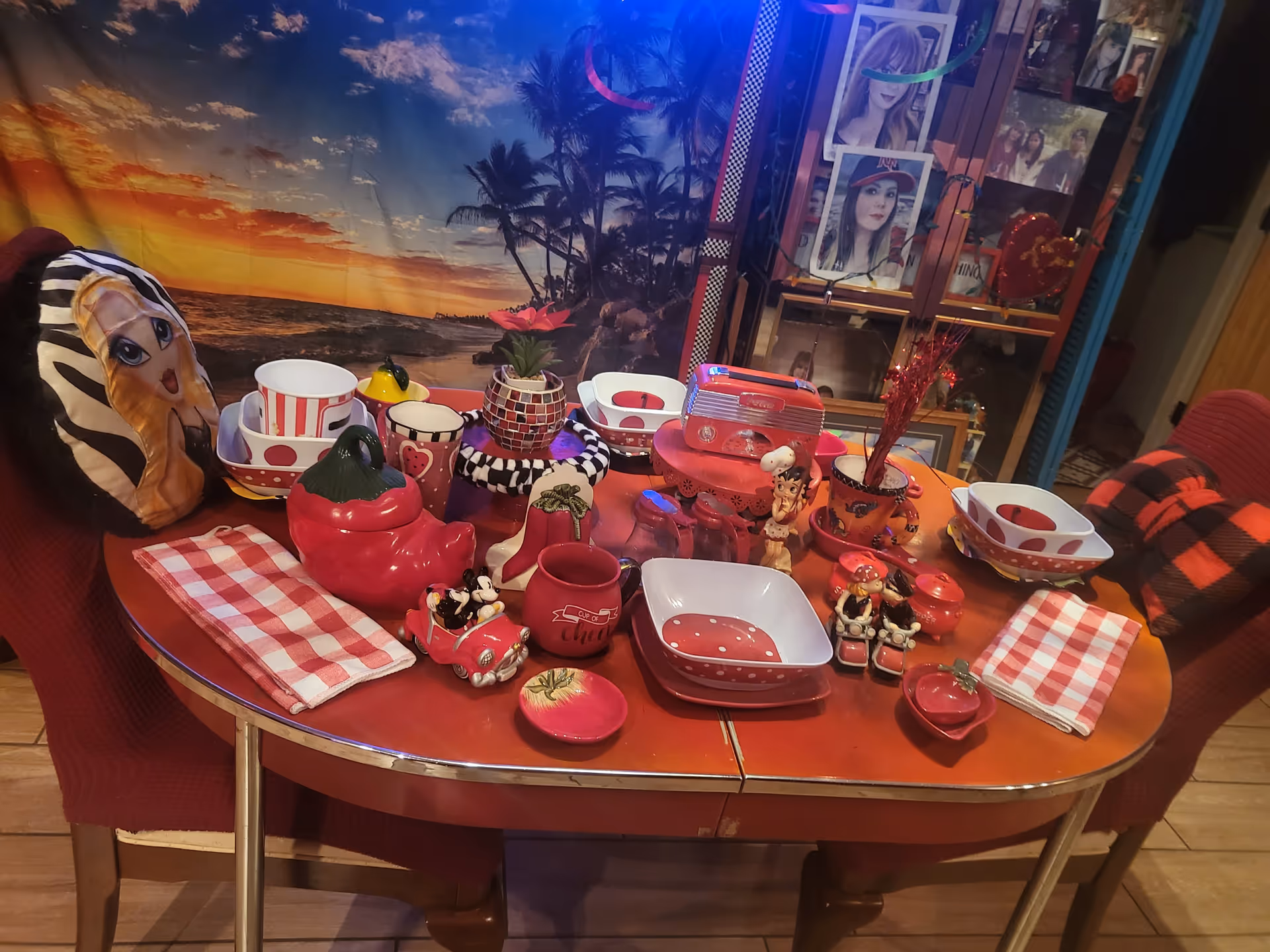 Colorful table setting with red and white dishes in a dining room