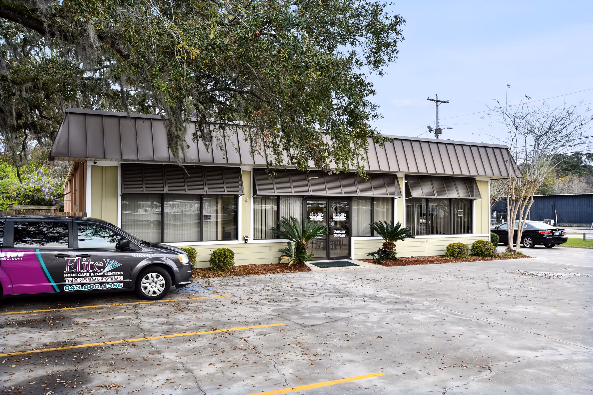 Exterior view of Elite Home Care and Day Centers with a parked van