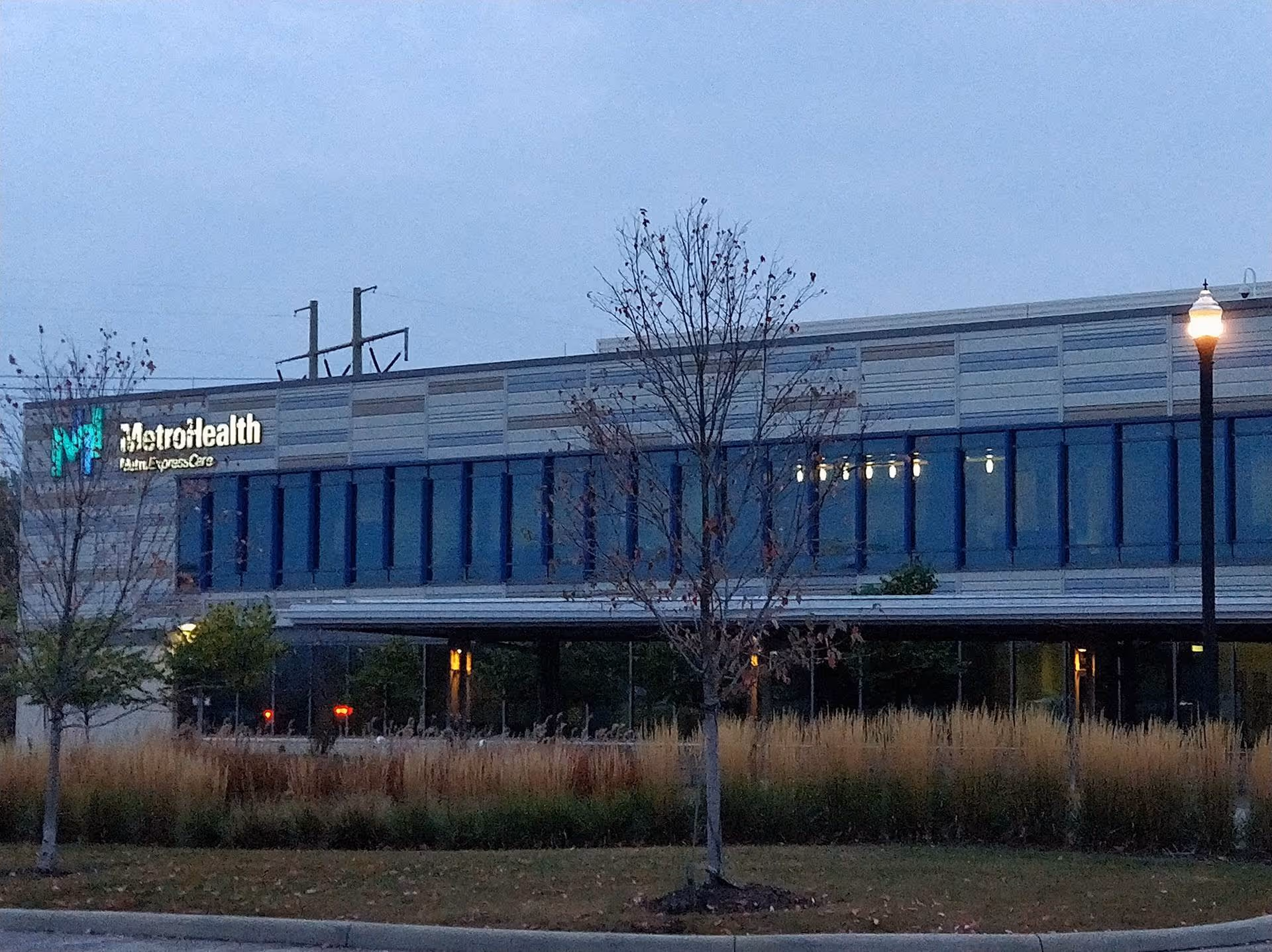 Exterior view of MetroHealth Middleburg Heights Family Health Center with trees and landscaping.