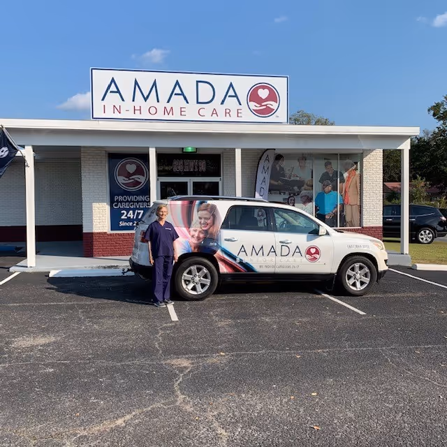 Front view of Amada Senior Care building with branded vehicle in parking lot