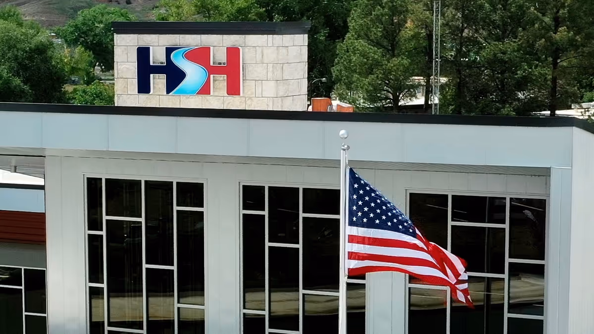 Exterior view of Hot Springs Health building with a waving American flag.