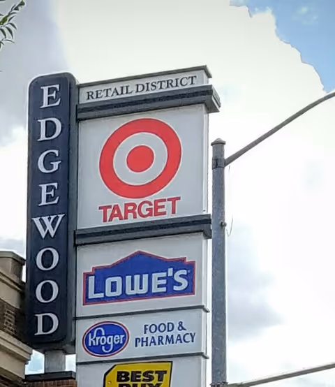 Tall exterior sign displays Target, Lowe's, and Kroger Food & Pharmacy logos.