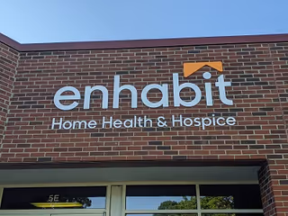 Brick exterior with an Enhabit Home Health & Hospice sign above entrance.