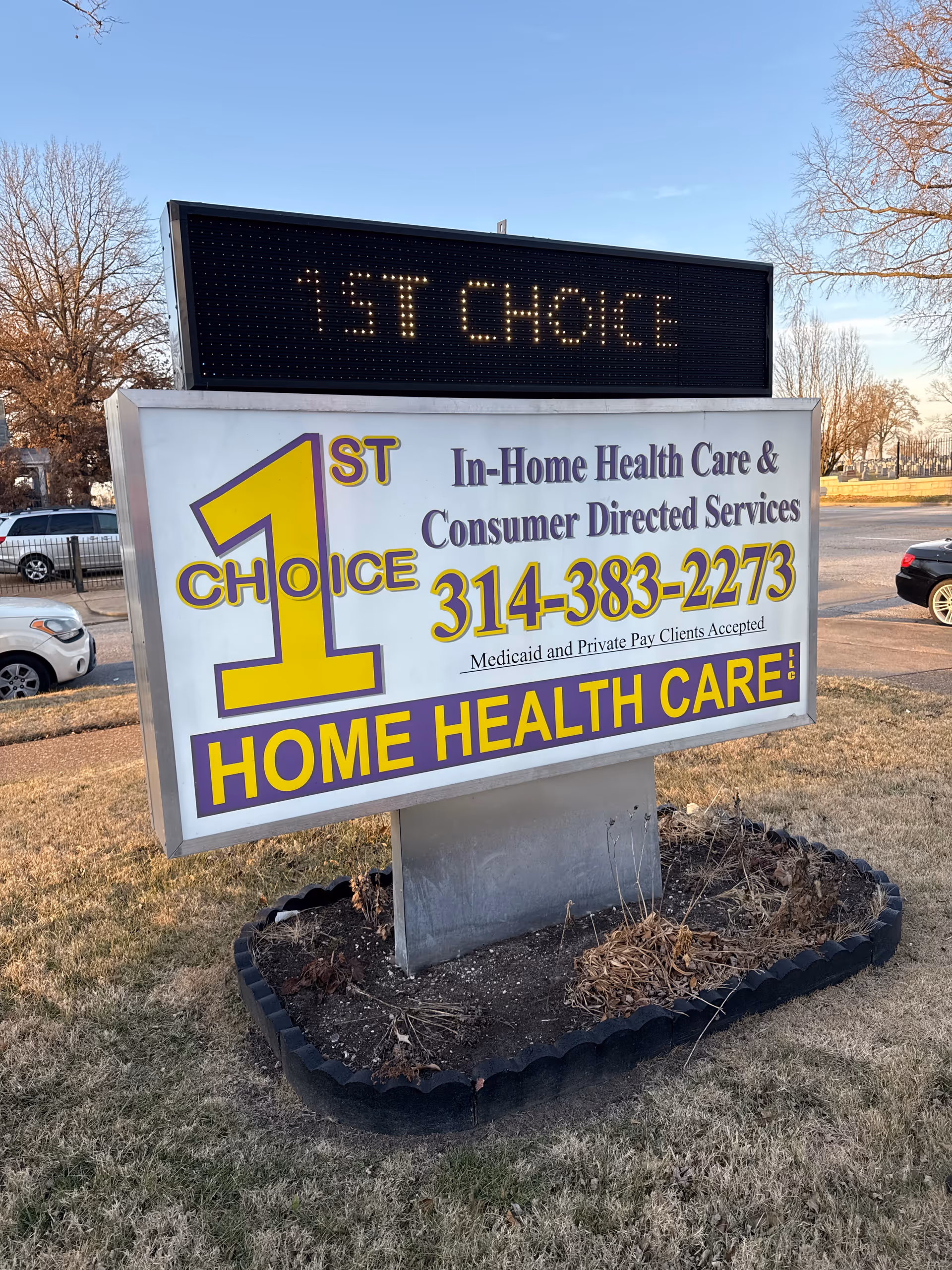 Exterior sign for 1st Choice Home Health Care with phone number on lawn