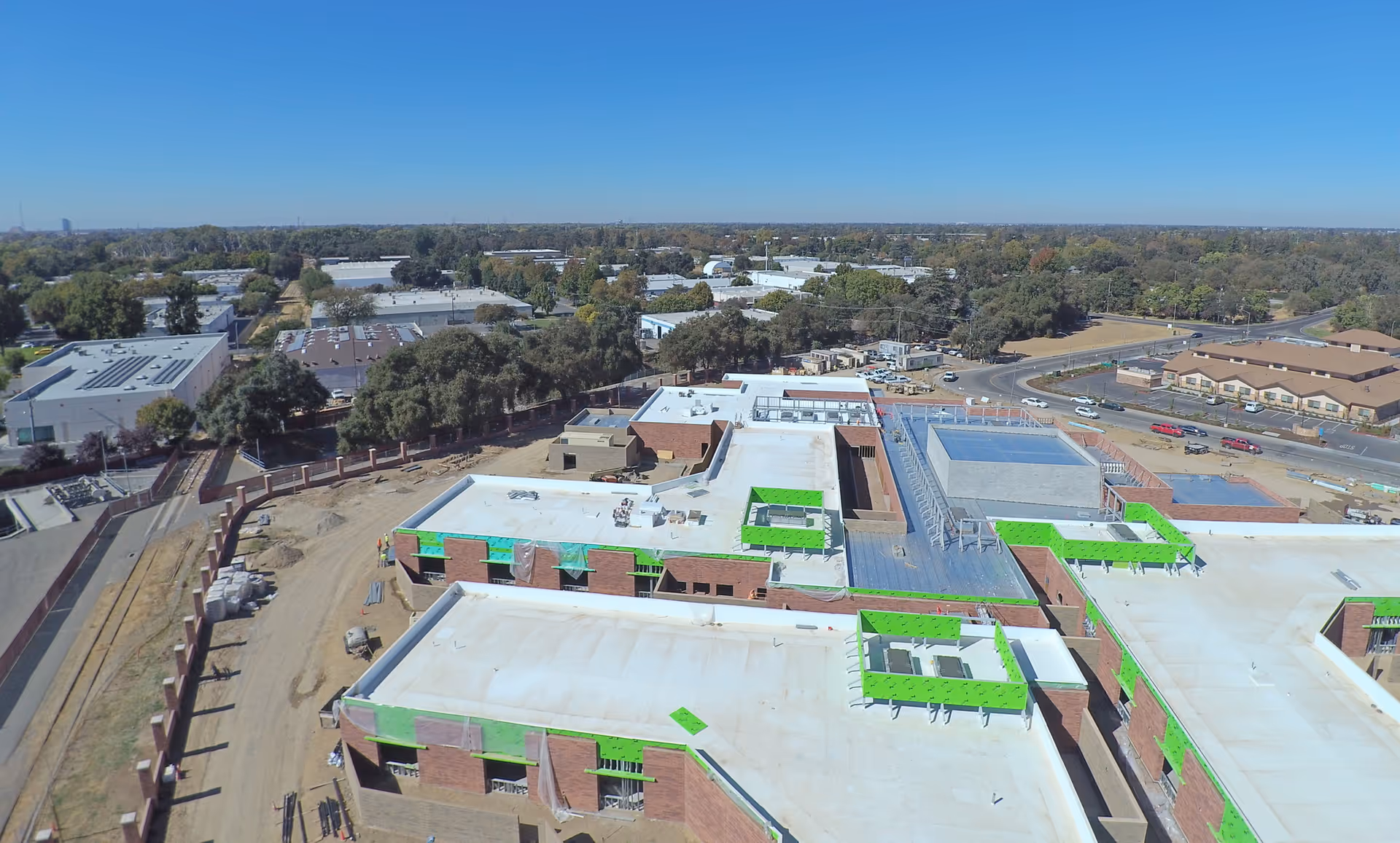 Aerial view of Apria Healthcare facility under construction with green roof insulation.