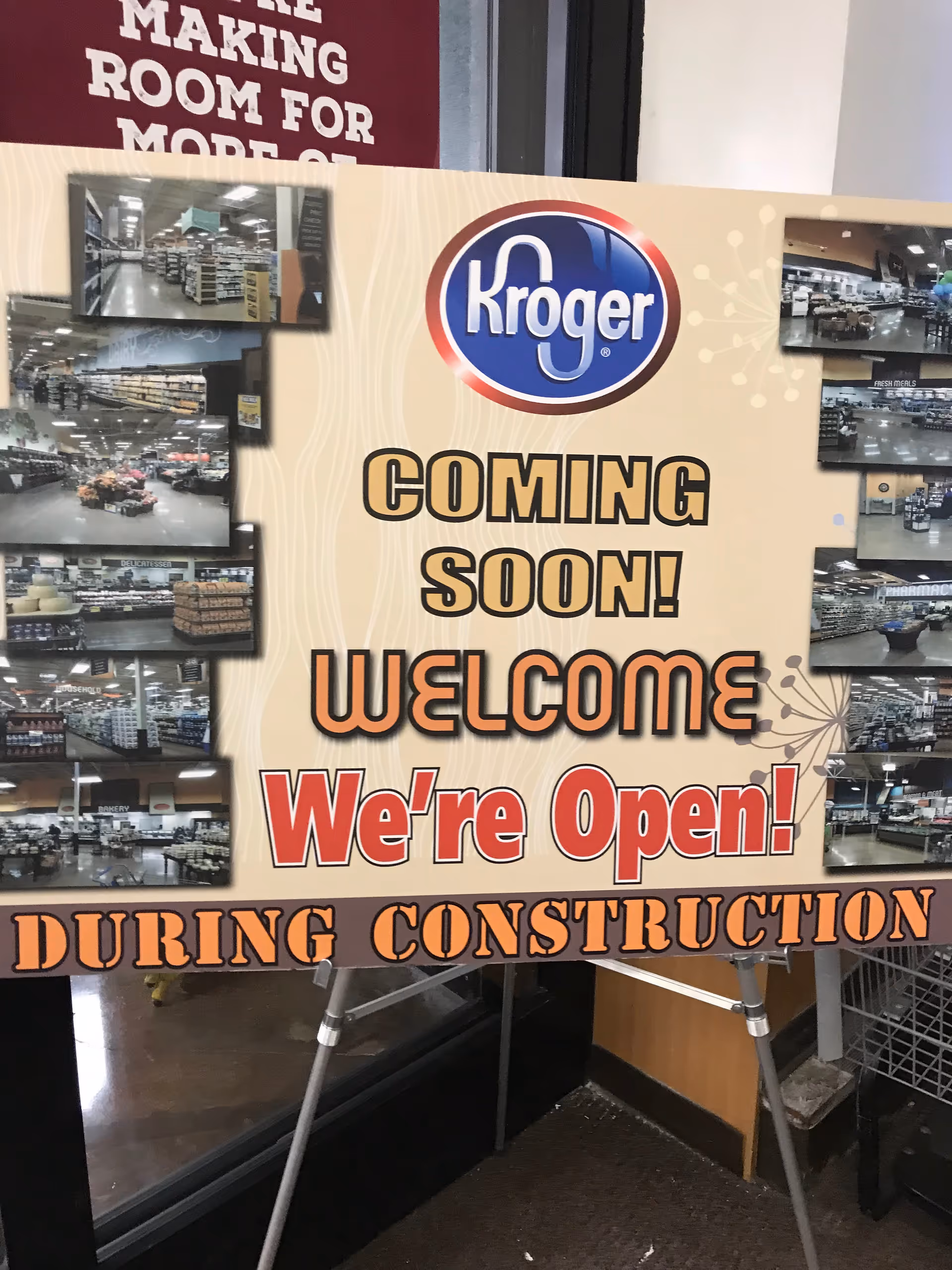 Interior signboard with Kroger logo announcing opening during construction.