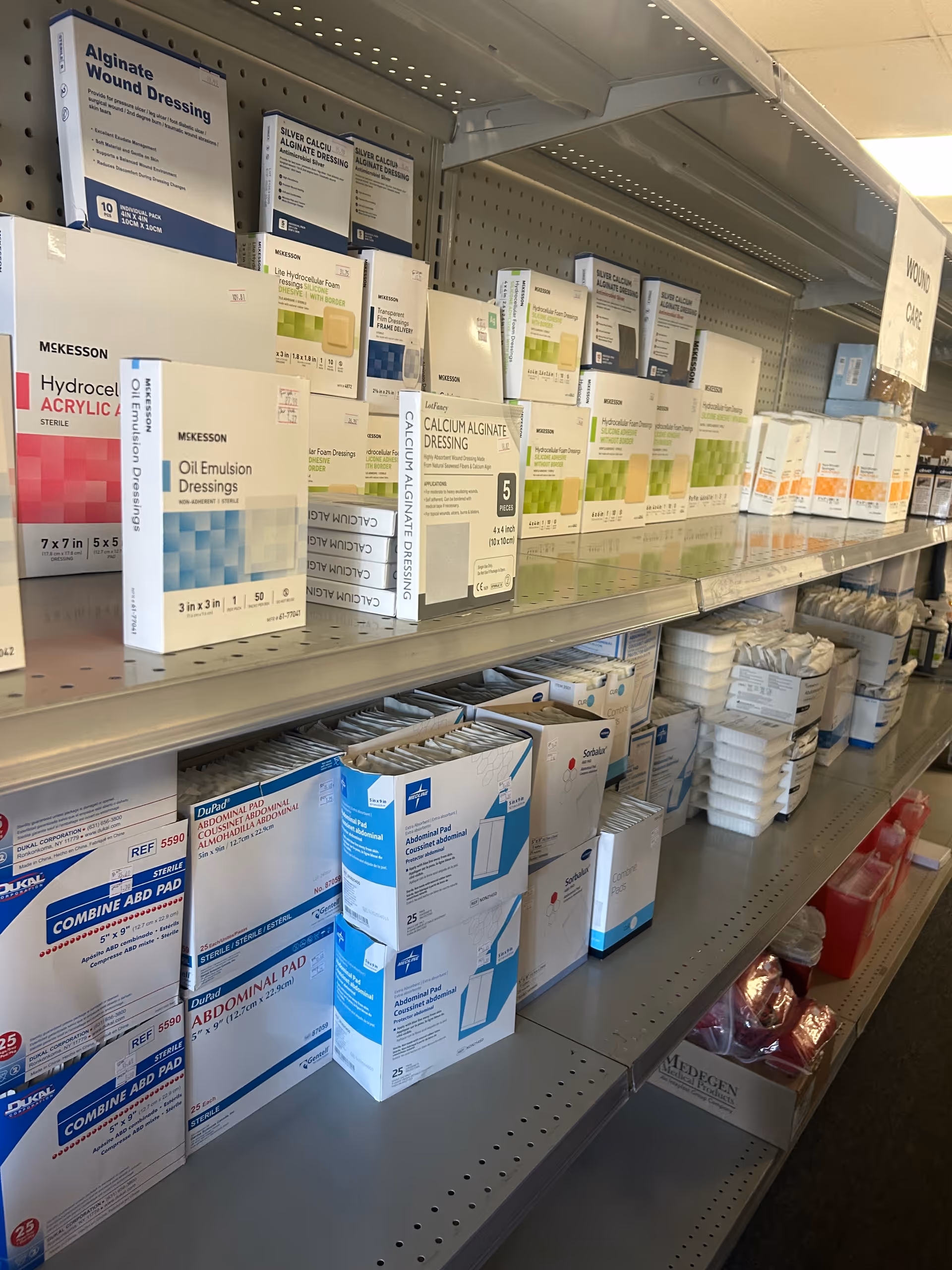 Shelves filled with medical dressings and supplies in an indoor facility.
