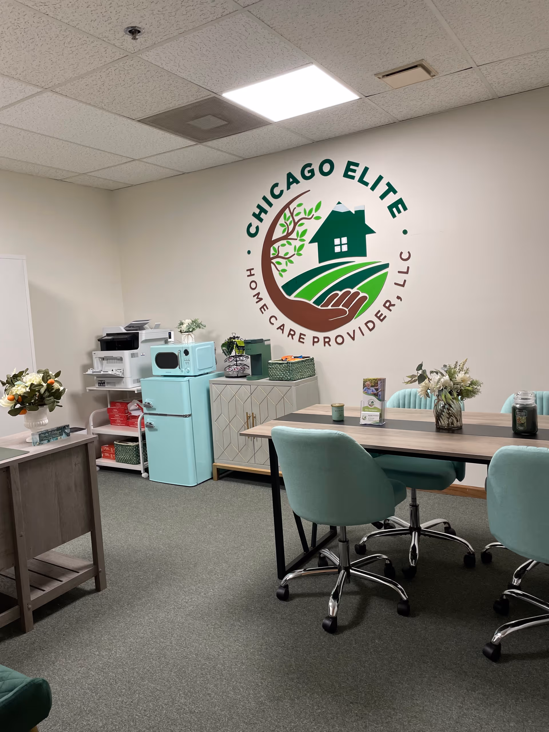 Interior room featuring the Chicago Elite logo on the wall with a table and chairs.