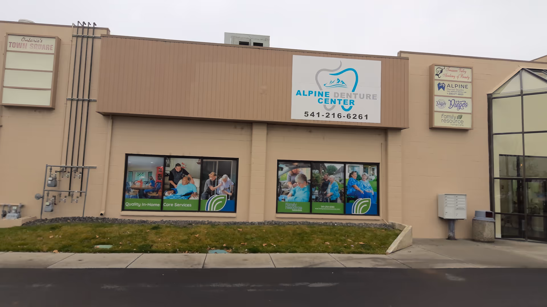 Front of a beige commercial building with Alpine Dental Center and Family Resource Home Care signage.