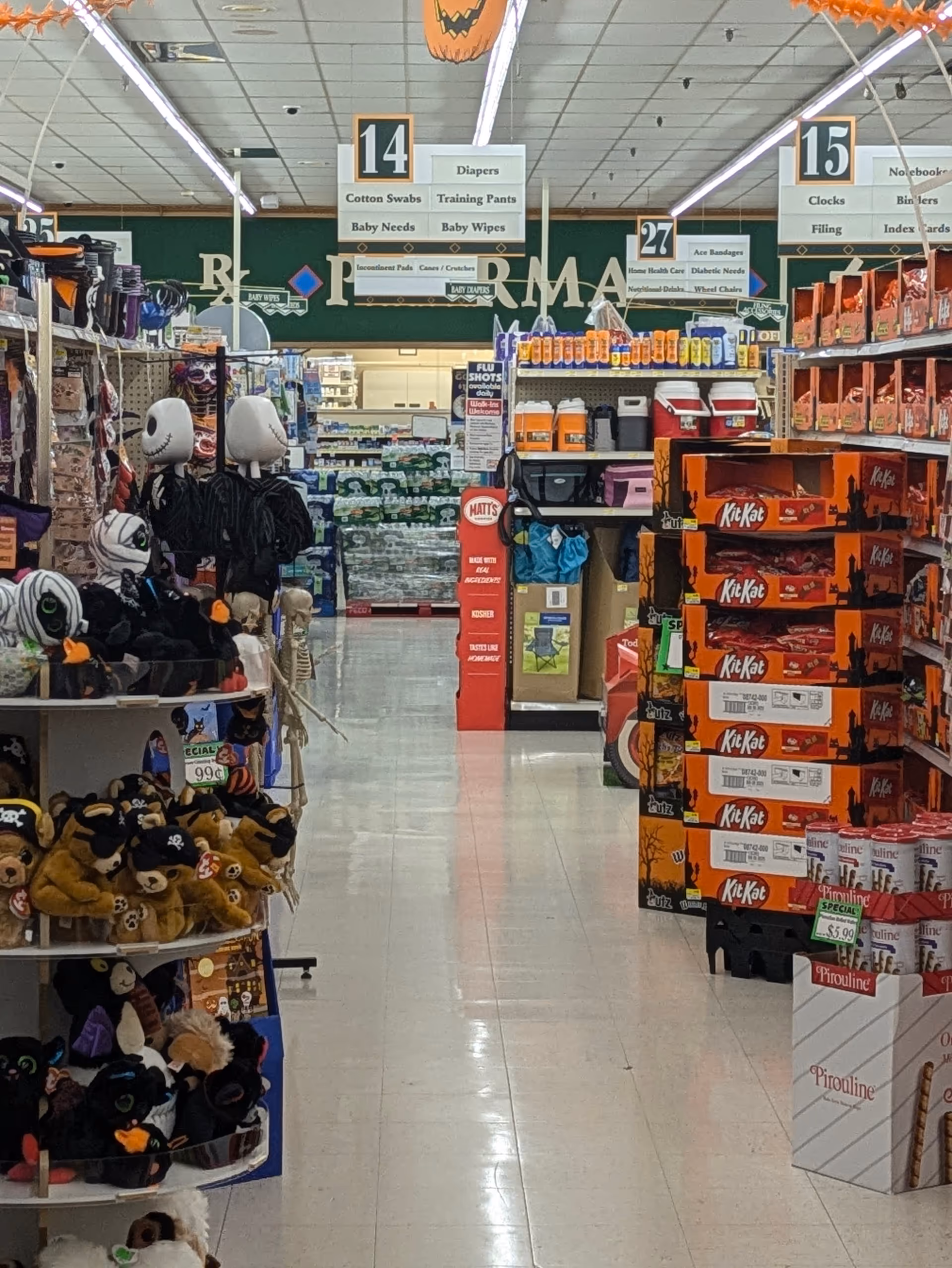 Interior of Discount Drug Mart with shelves of toys and boxed goods.