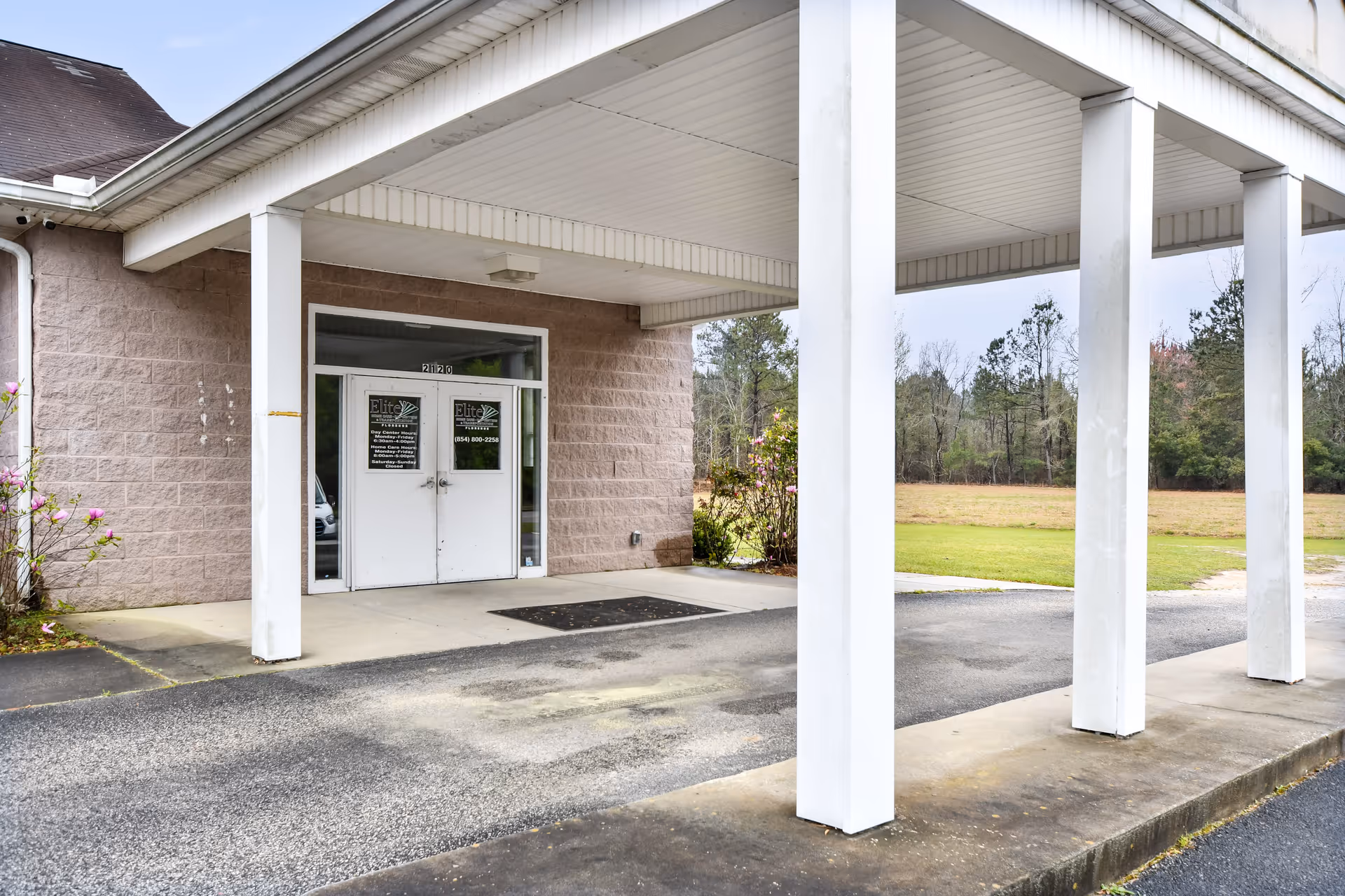 Exterior view of Elite Home Care entrance with a white columned canopy.