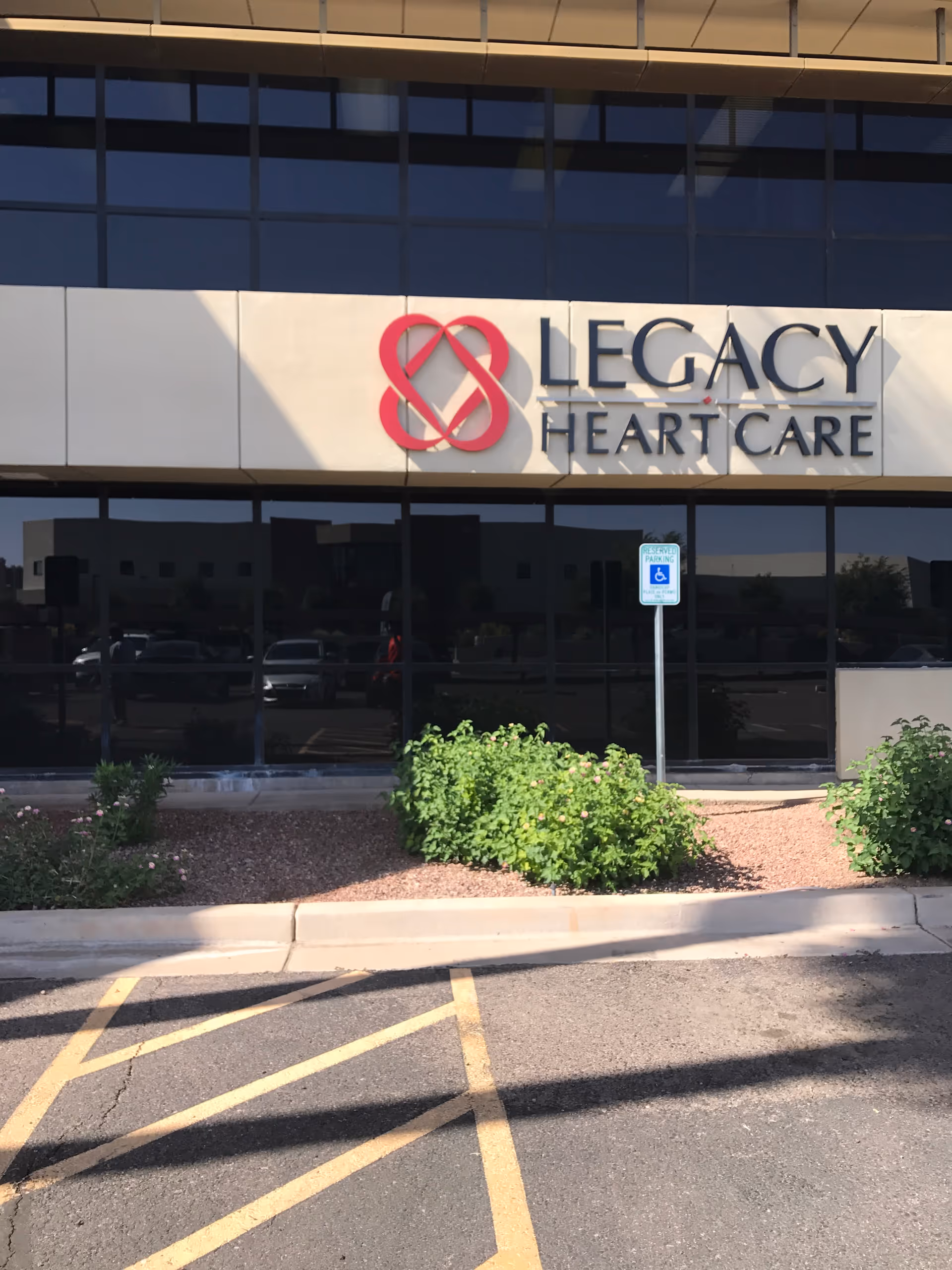 Front exterior of a medical building with a large Legacy Heart Care sign.