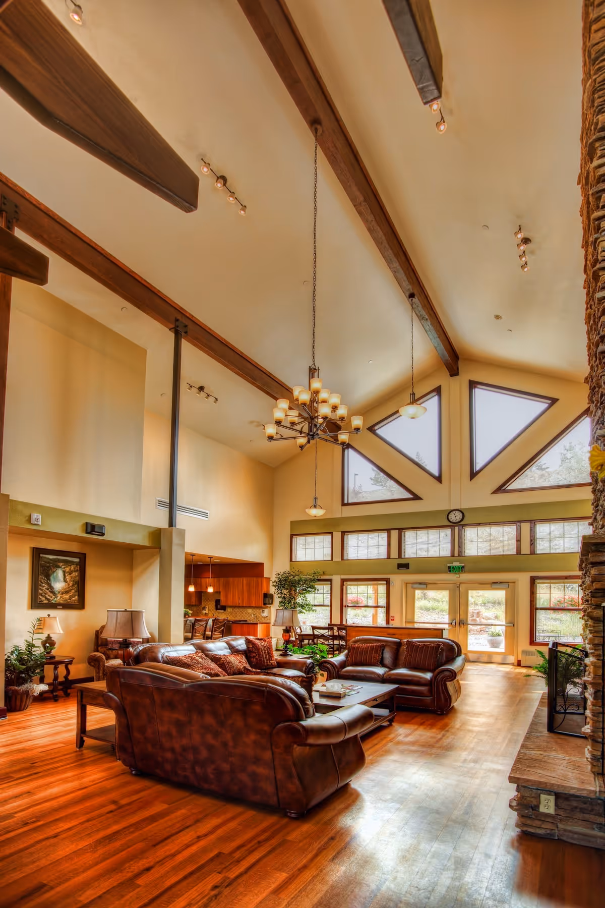 Spacious living room in Cody Regional Health Spirit Mountain Hospice House with leather seating.