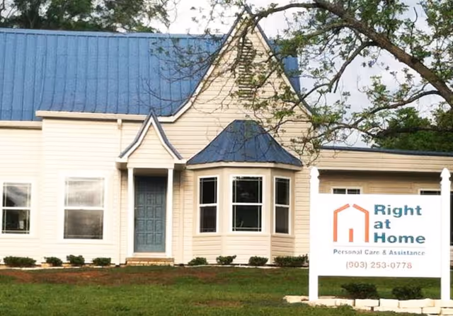 Exterior view of a Right at Home facility with blue roof and sign.
