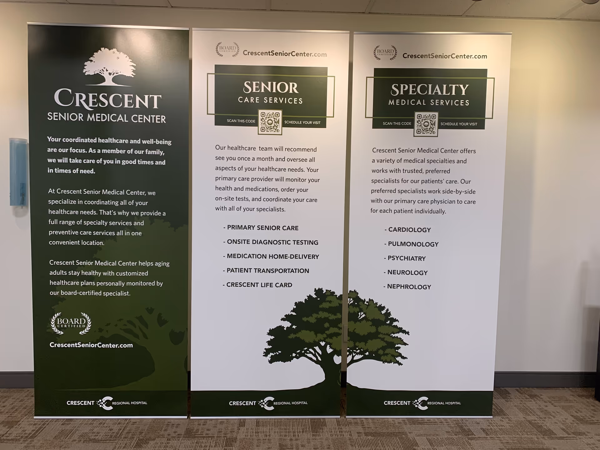 Three vertical banners advertising Crescent Senior Medical Center stand in a hallway.