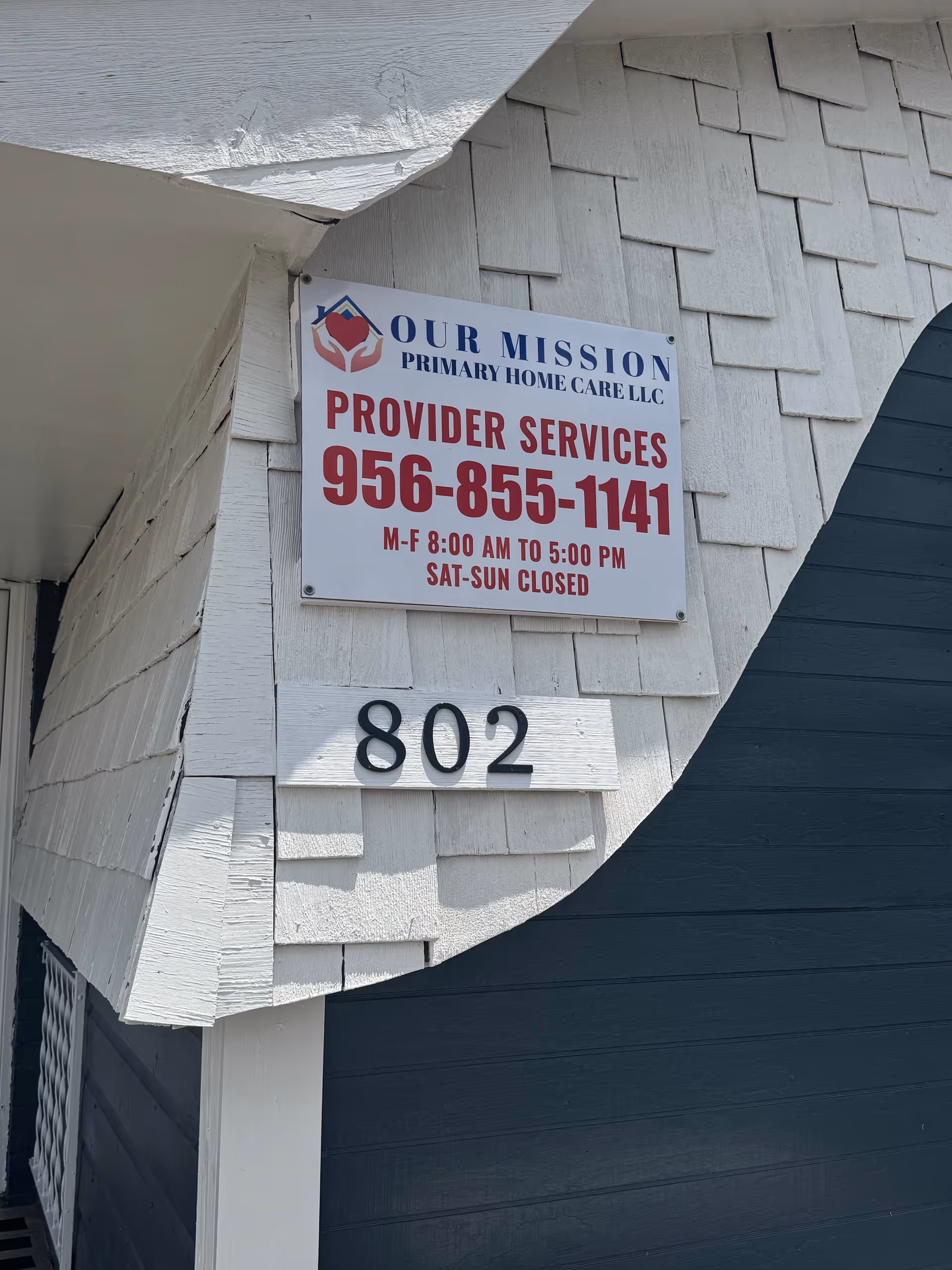 Exterior view of a building with OUR MISSION PRIMARY HOME CARE sign and 802.