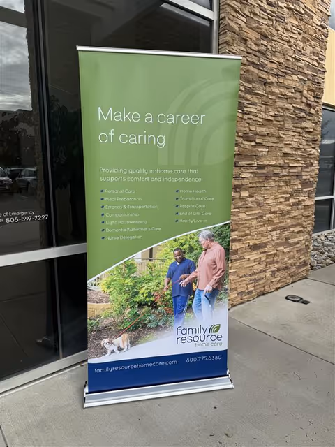 Green and blue banner outside a stone entrance advertising Family Resource Home Care.