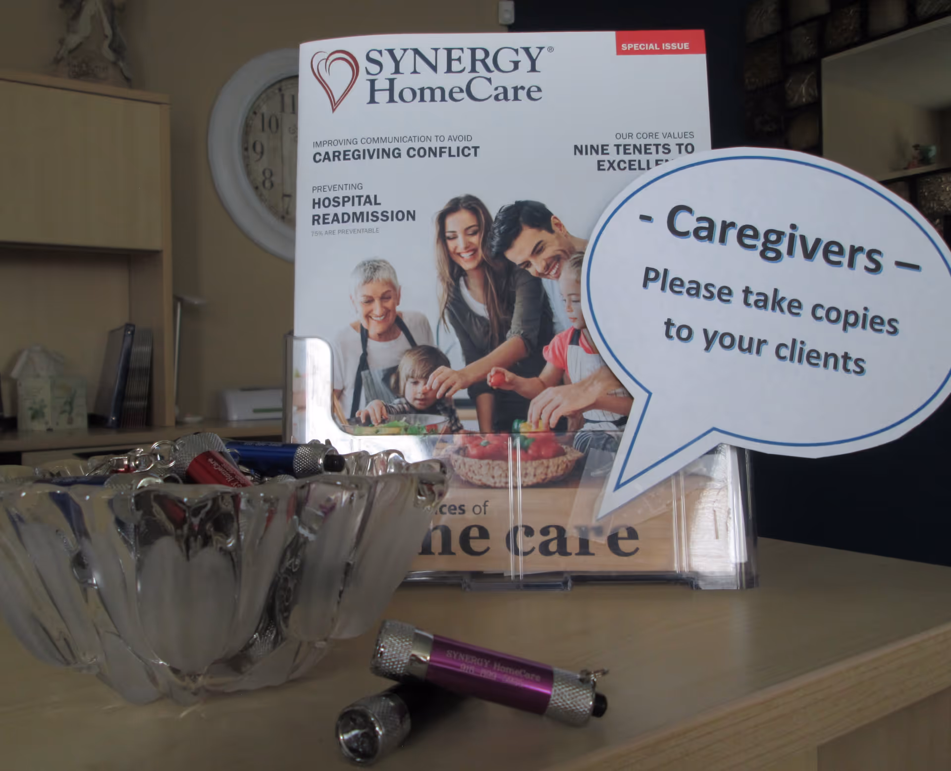 Synergy HomeCare brochure and caregiver sign displayed on a desk