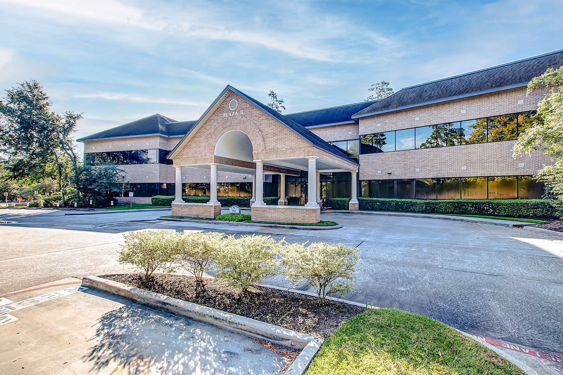 Exterior view of a Comfort Keepers senior living facility with a covered entrance and parking.