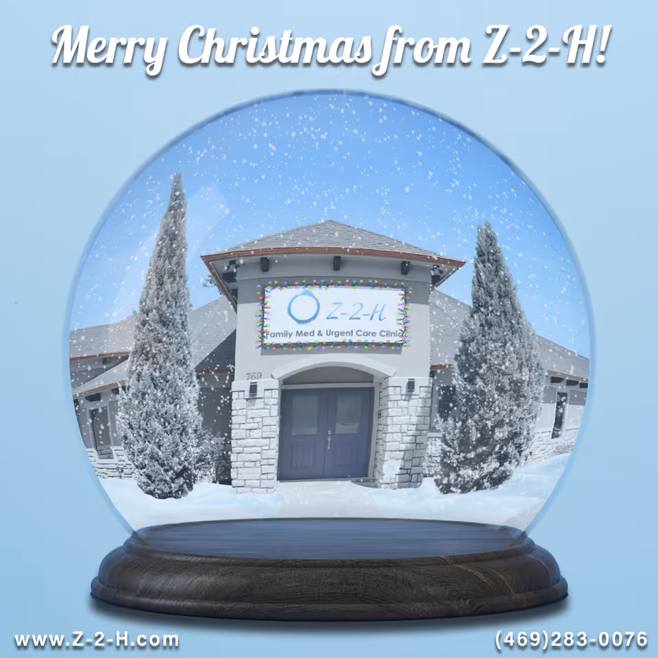 Snow globe view of Z-2-H clinic front with Christmas greeting and snow.