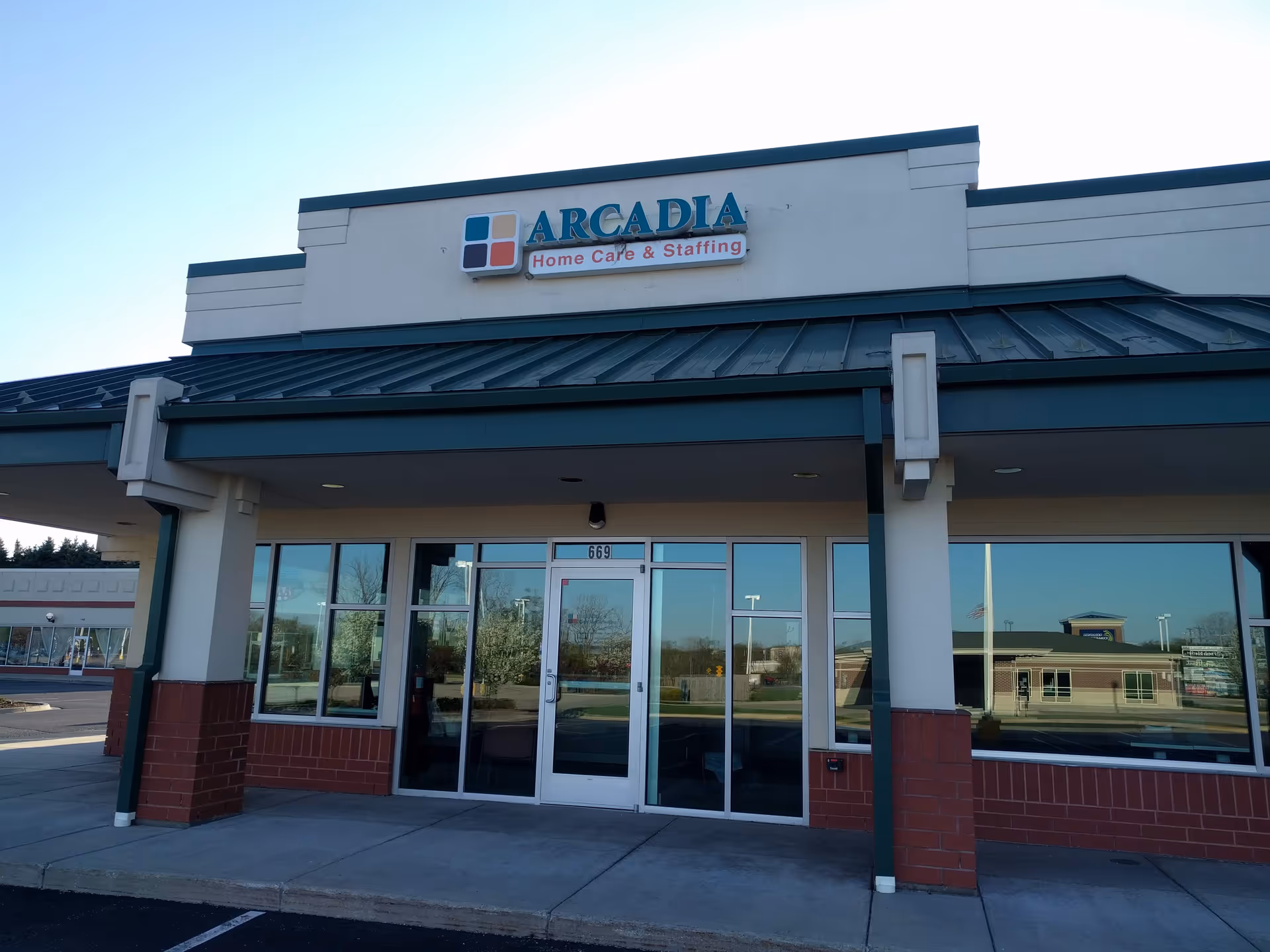 Front view of Arcadia Home Care and Staffing building with glass entrance