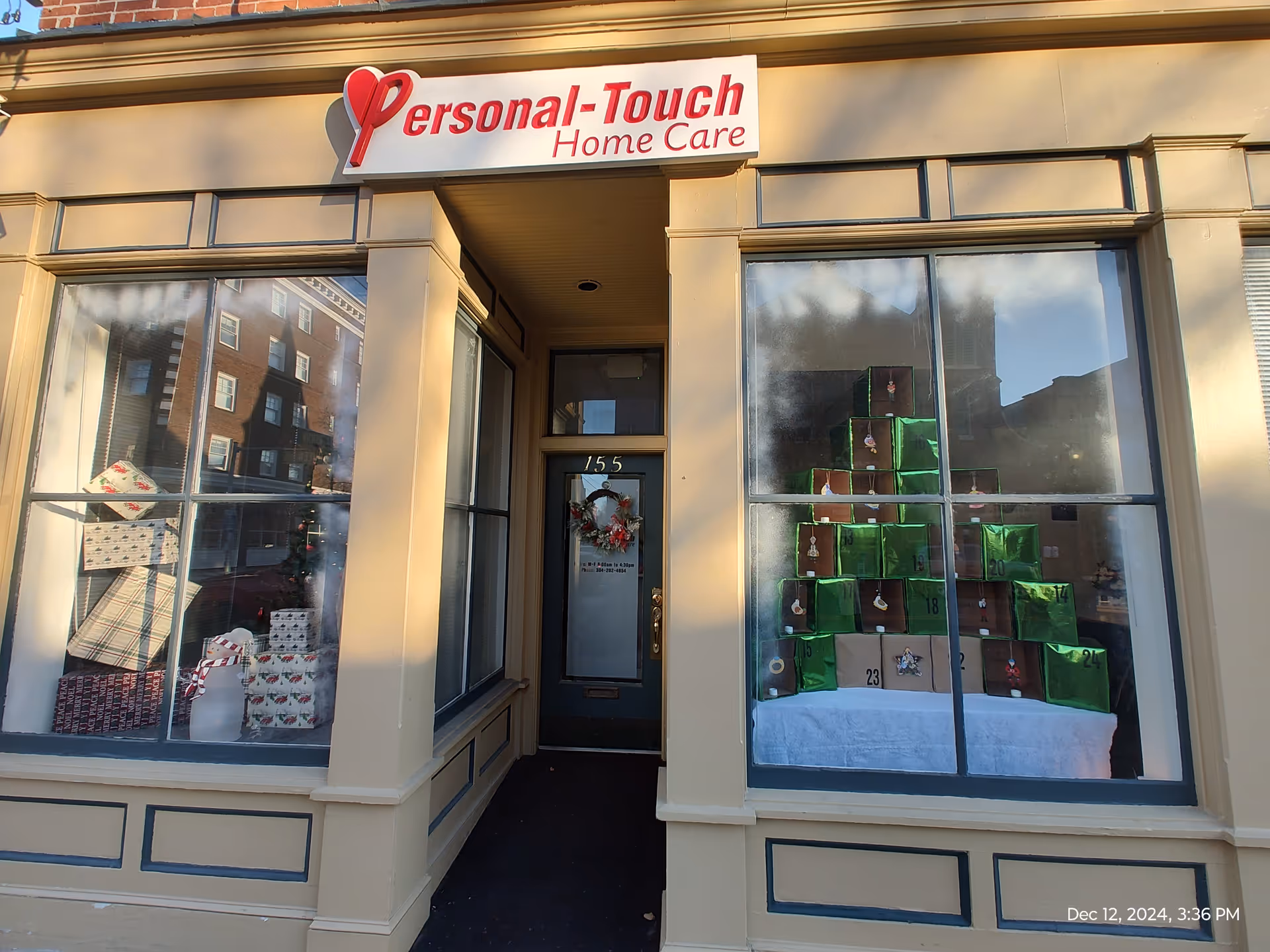 Storefront of Personal-Touch Home Care with large windows and gift displays.