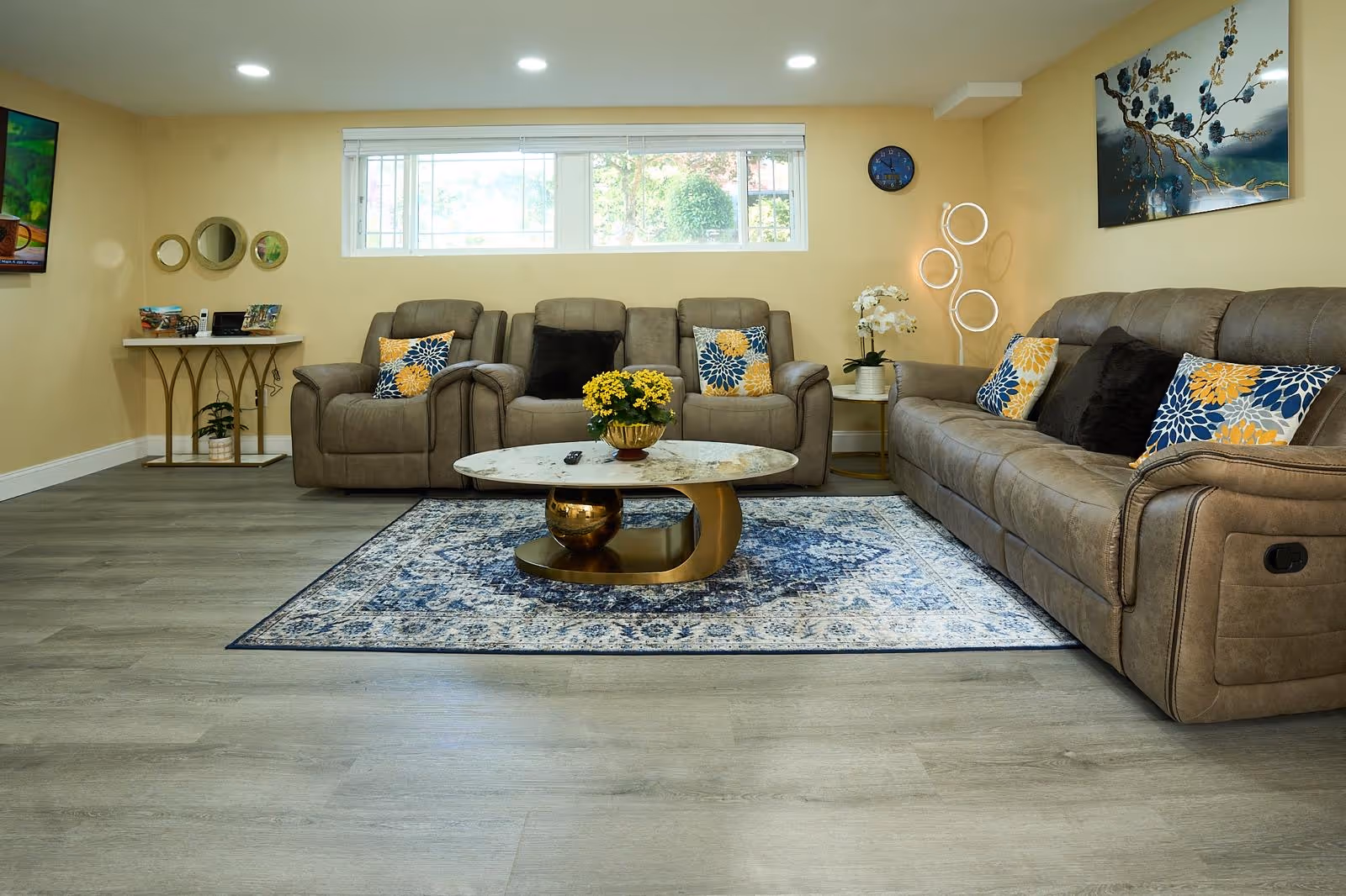 Cozy living room in a senior facility with sofas, coffee table, and decor.