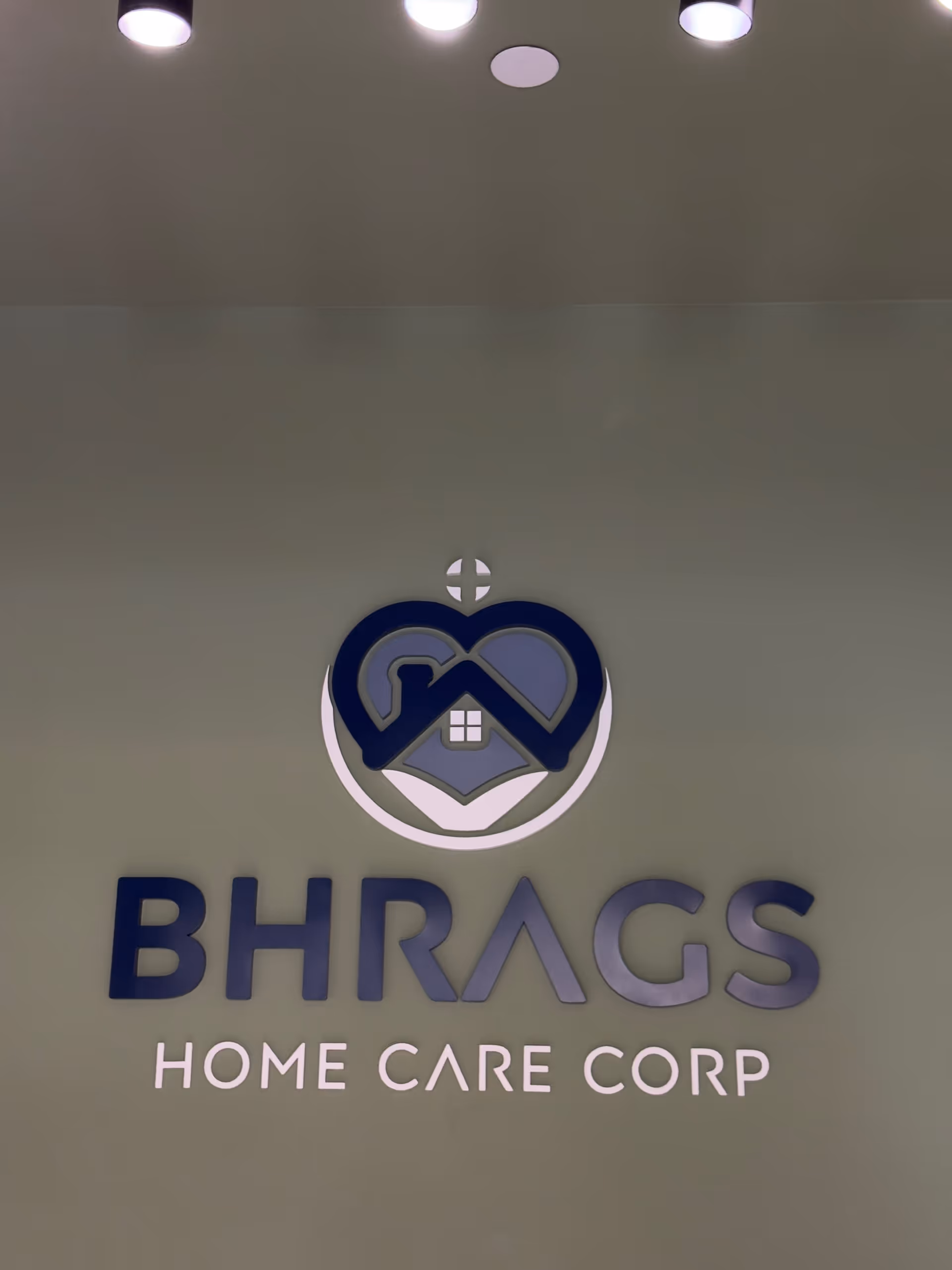Interior wall featuring BHRAGS Home Care Corp logo emblem
