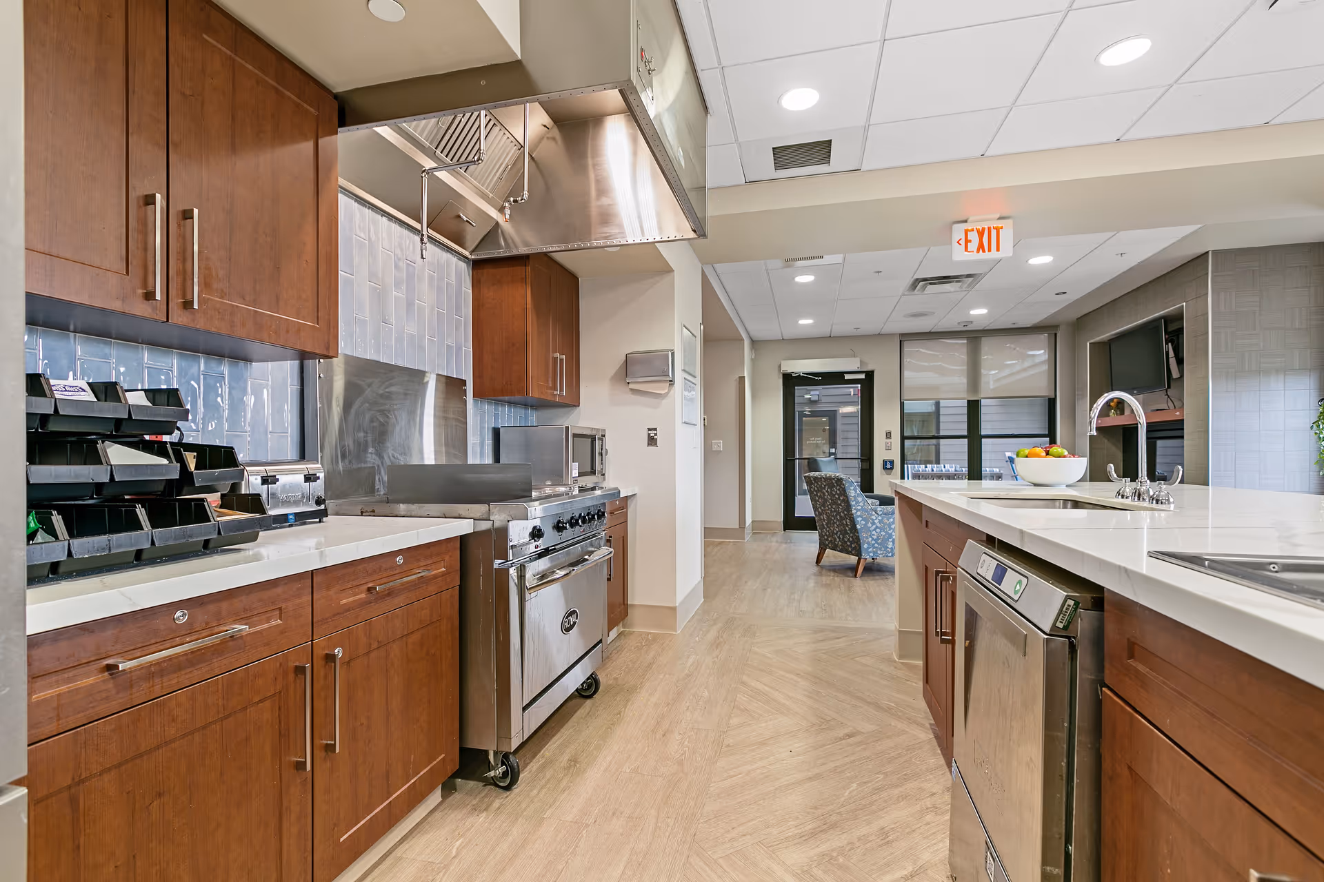 Bright, modern kitchen with wooden cabinets, stainless appliances, and a large island.