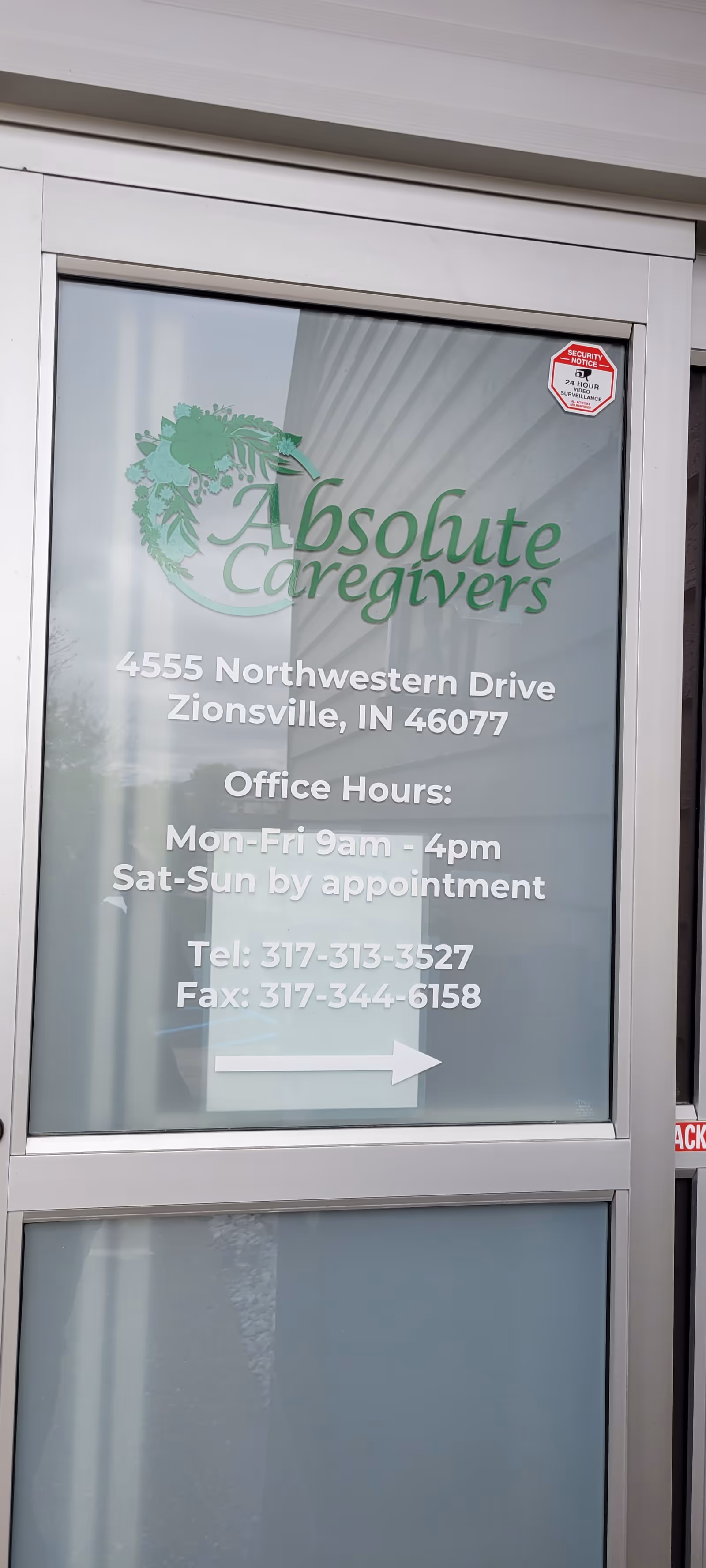 Glass entrance with Absolute Caregivers logo and address for Zionsville location.