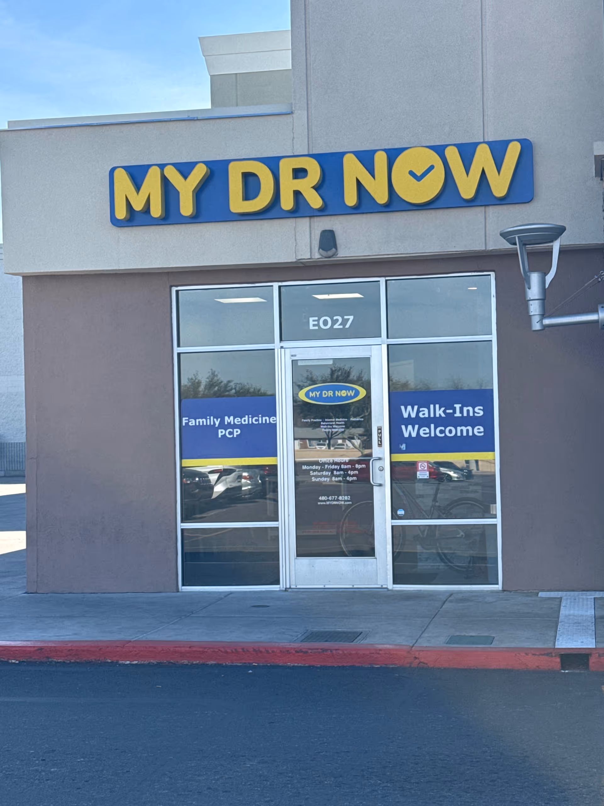 Front view of MY DR NOW clinic with glass doors and Walk-Ins Welcome signs.