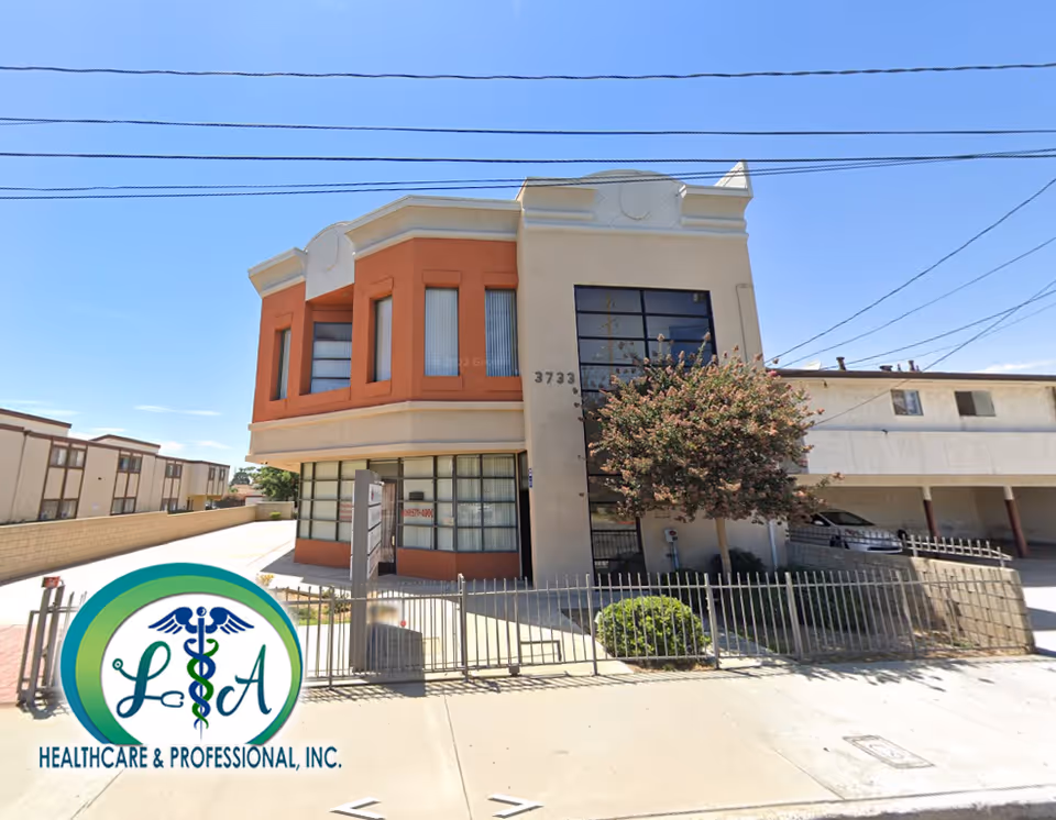 Two-story building with orange accents and LA Healthcare & Professional, Inc. logo in foreground.