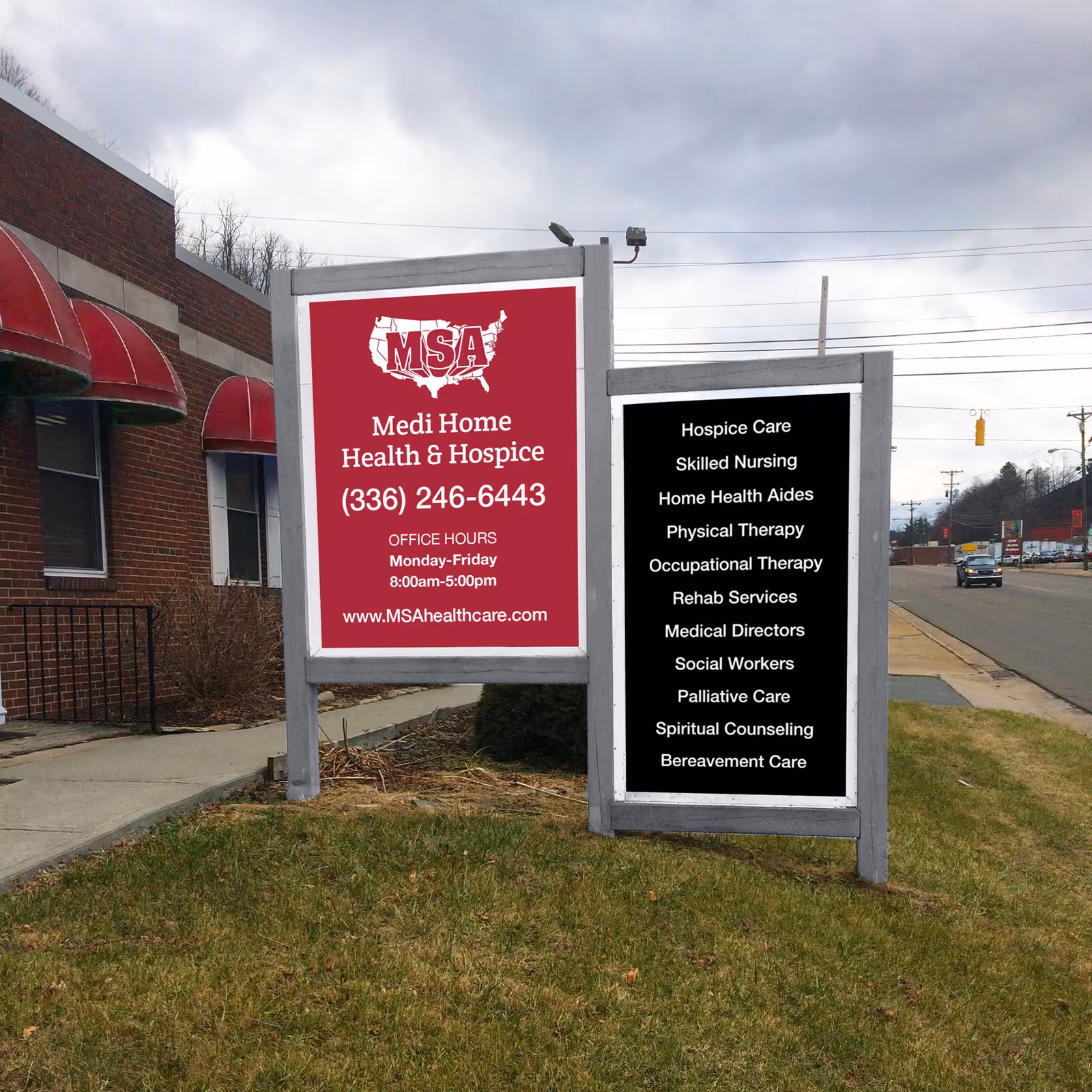 Two freestanding signs outside Medi Home Health & Hospice beside a brick building.