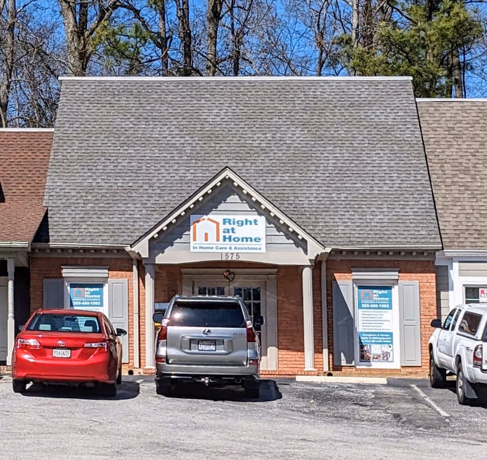 Front of Right at Home care facility with parked cars visible.