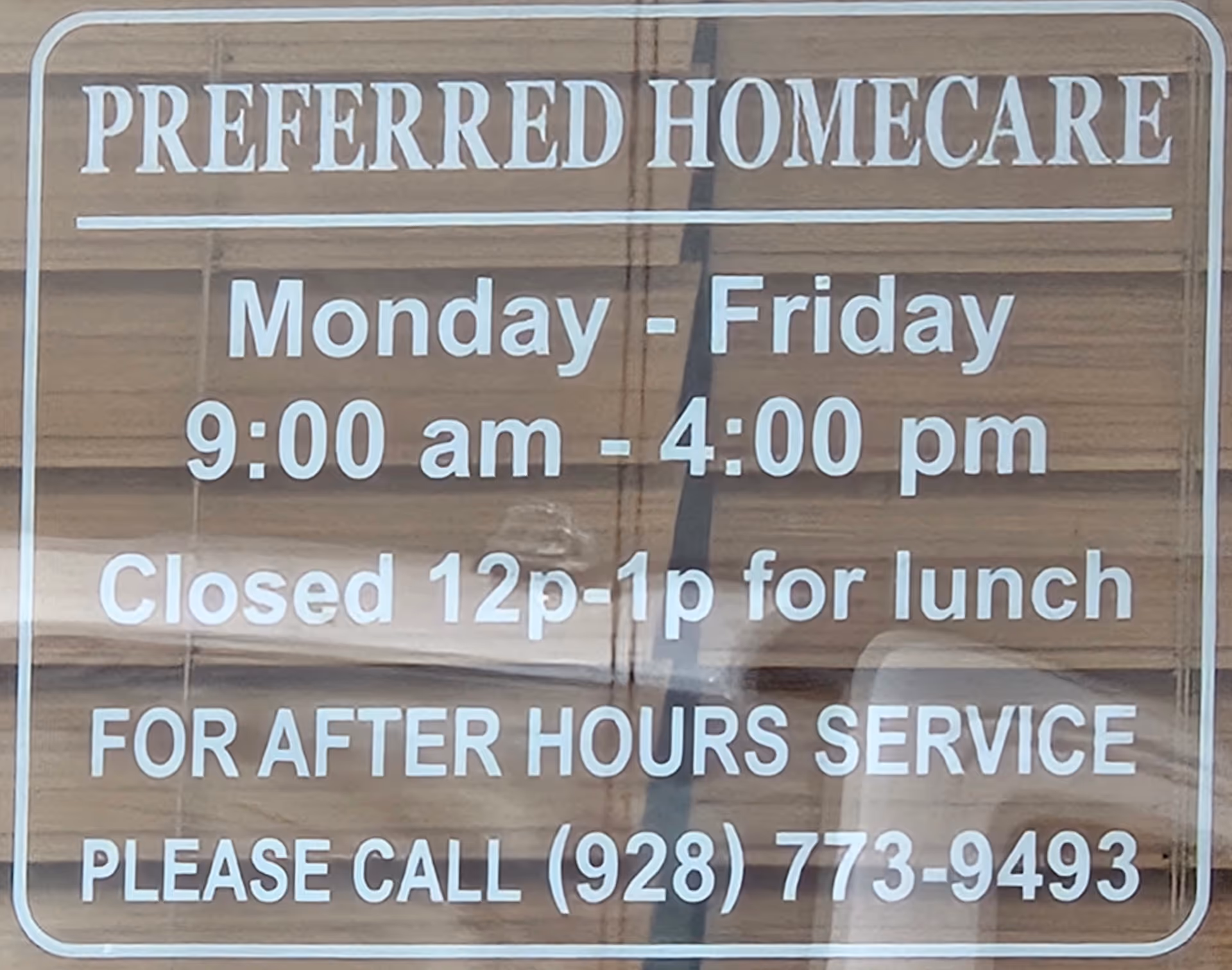 Front view of a sign reading Preferred Homecare with hours listed.