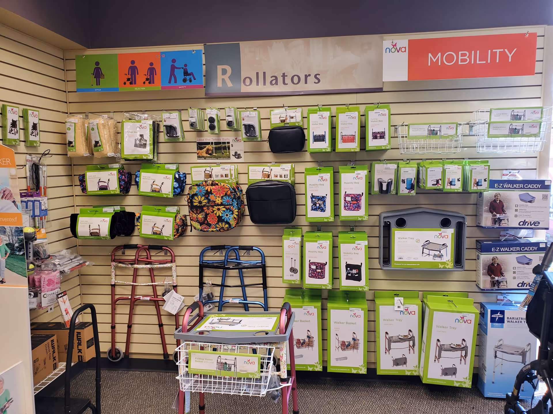 Indoor display wall featuring mobility aids and accessories, including rollators and walkers.
