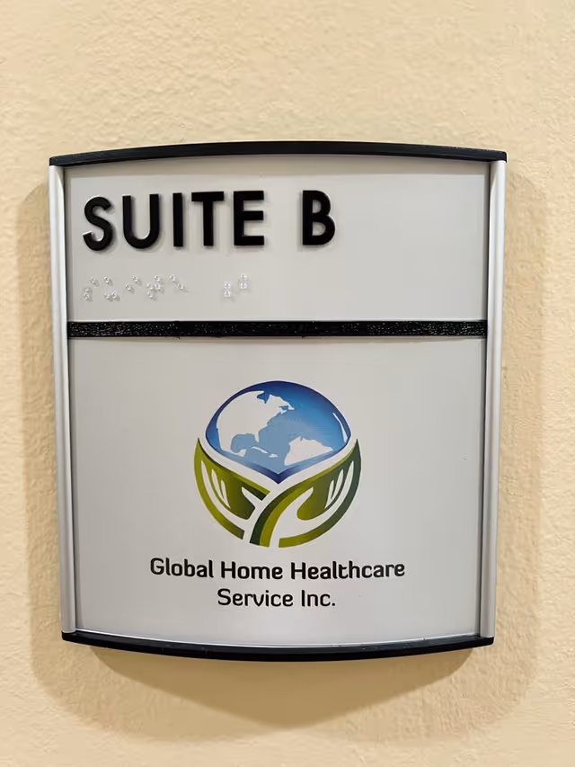 Interior wall sign reading Suite B with Global Home Healthcare Service Inc. logo.