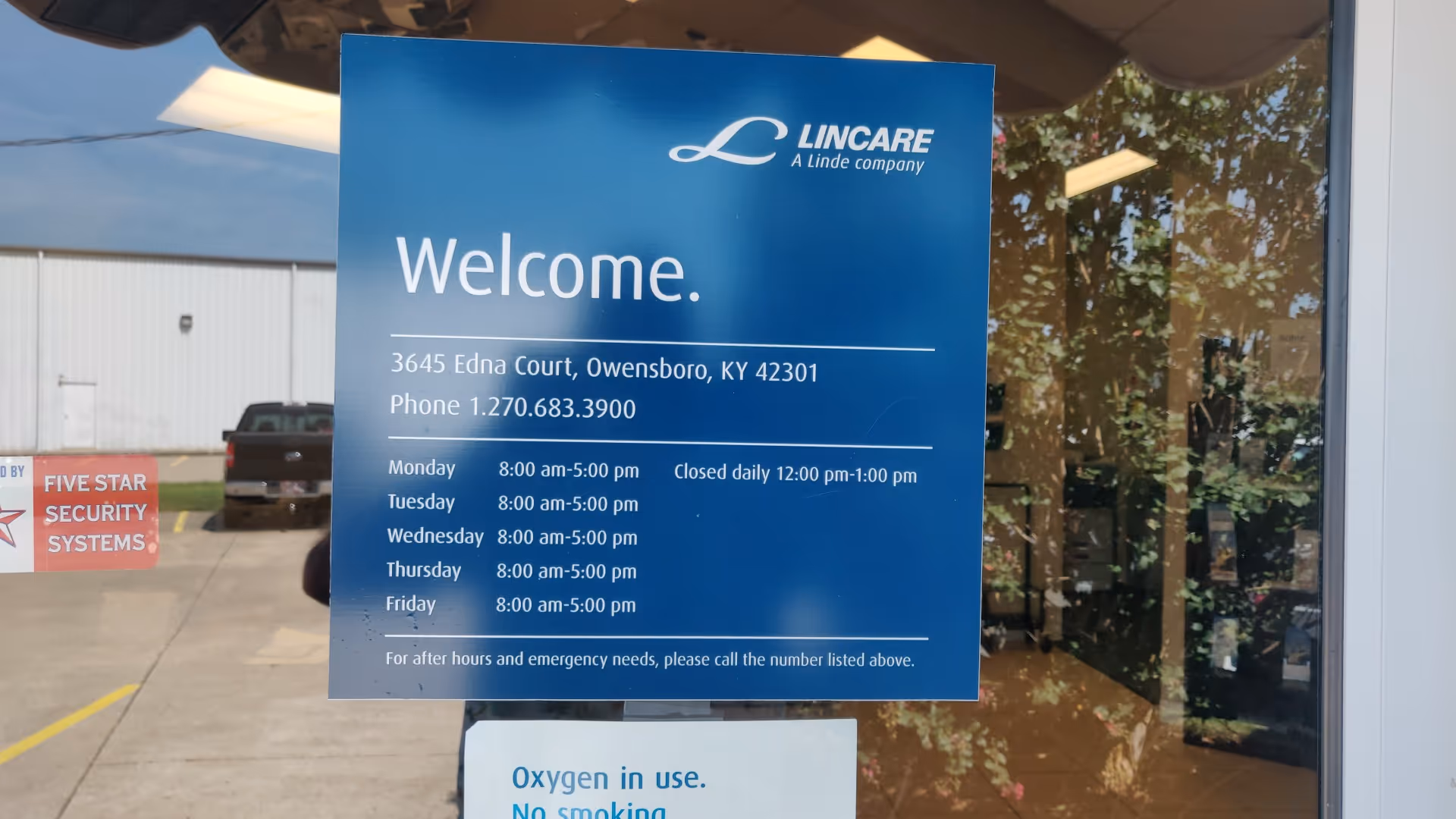 Blue LINCARE welcome sign on exterior glass storefront of the facility.