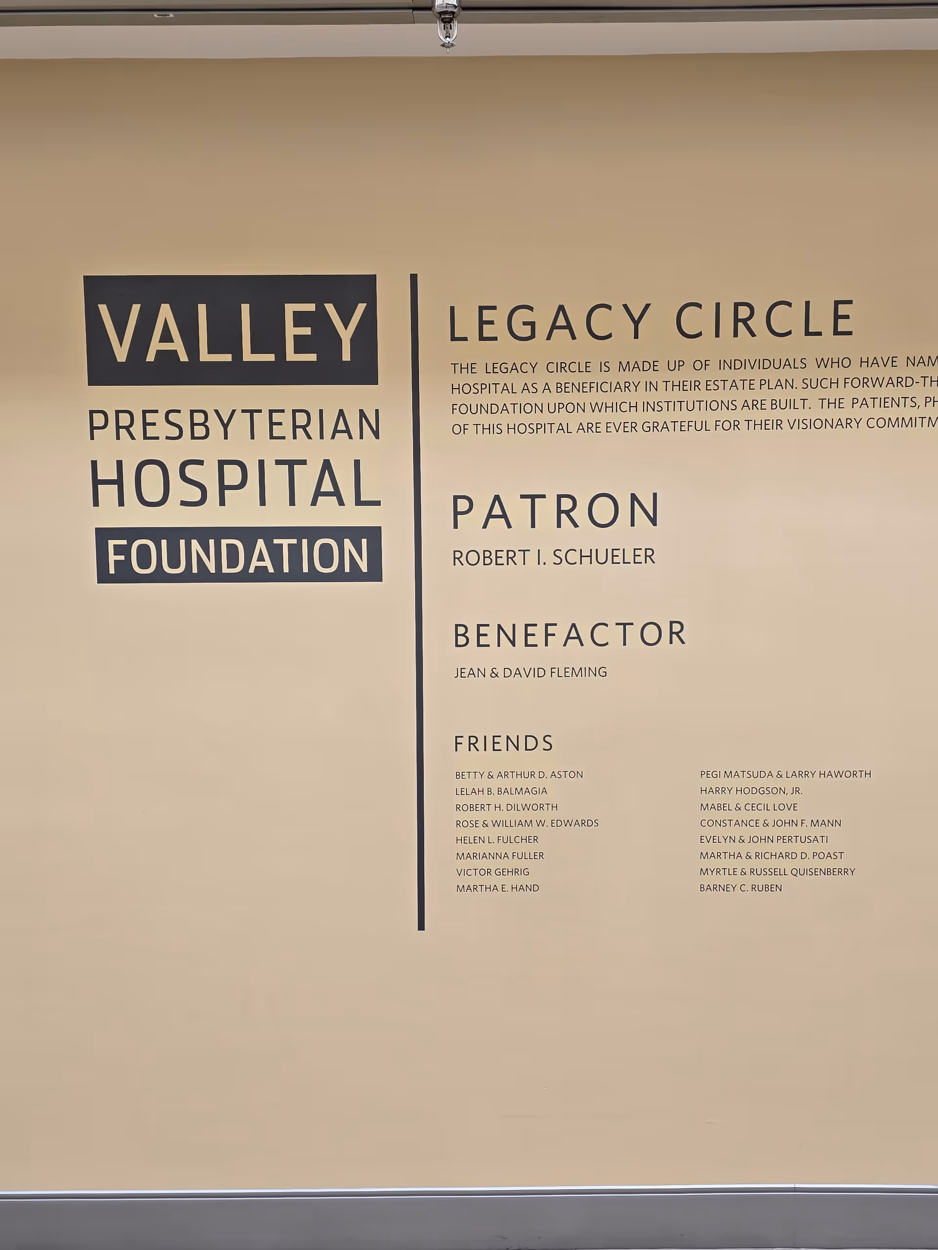 Interior wall with large Valley Presbyterian Hospital Foundation sign and donor listings
