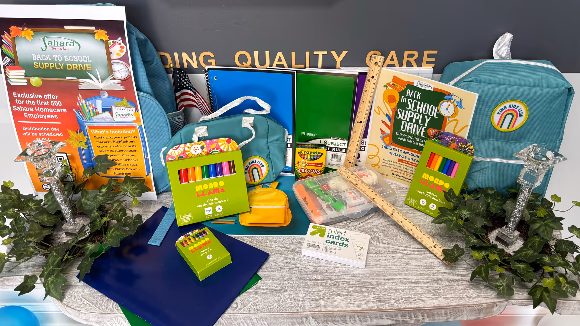 Back-to-school supplies displayed on a desk for Sahara Home Care drive.