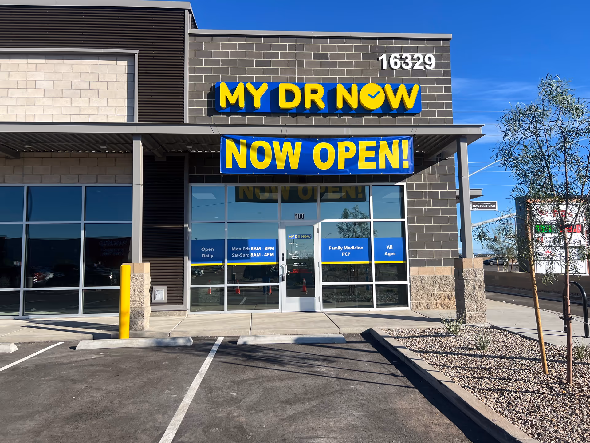 Exterior storefront with MY DR NOW sign and NOW OPEN banner.
