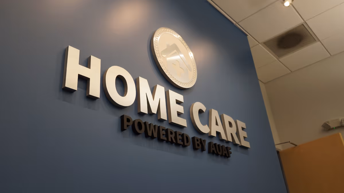 Blue interior wall with large HOME CARE sign and circular logo.