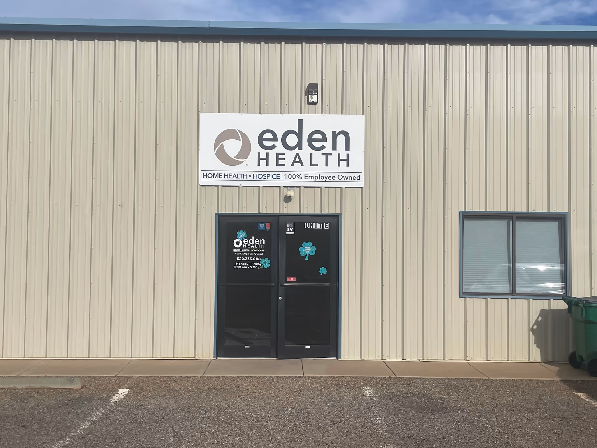 Exterior view of a beige Eden Health building with a sign above the entrance.
