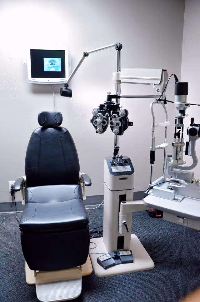 Ophthalmology exam chair and phoropter equipment in a clinic room