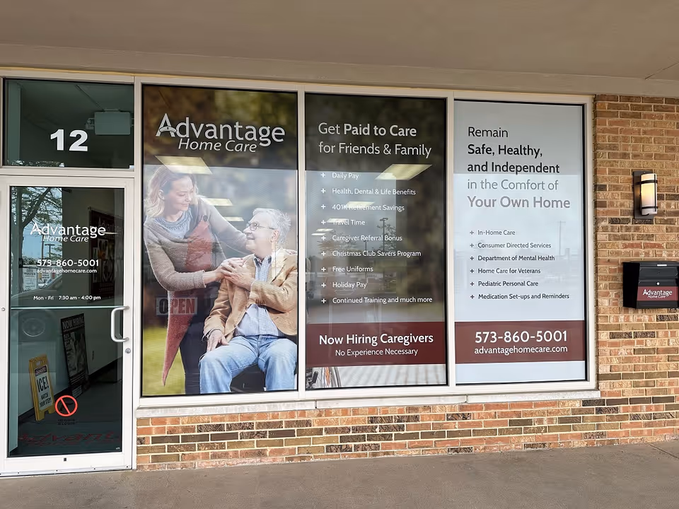 Storefront for Advantage Home Care featuring large window signs and a glass door