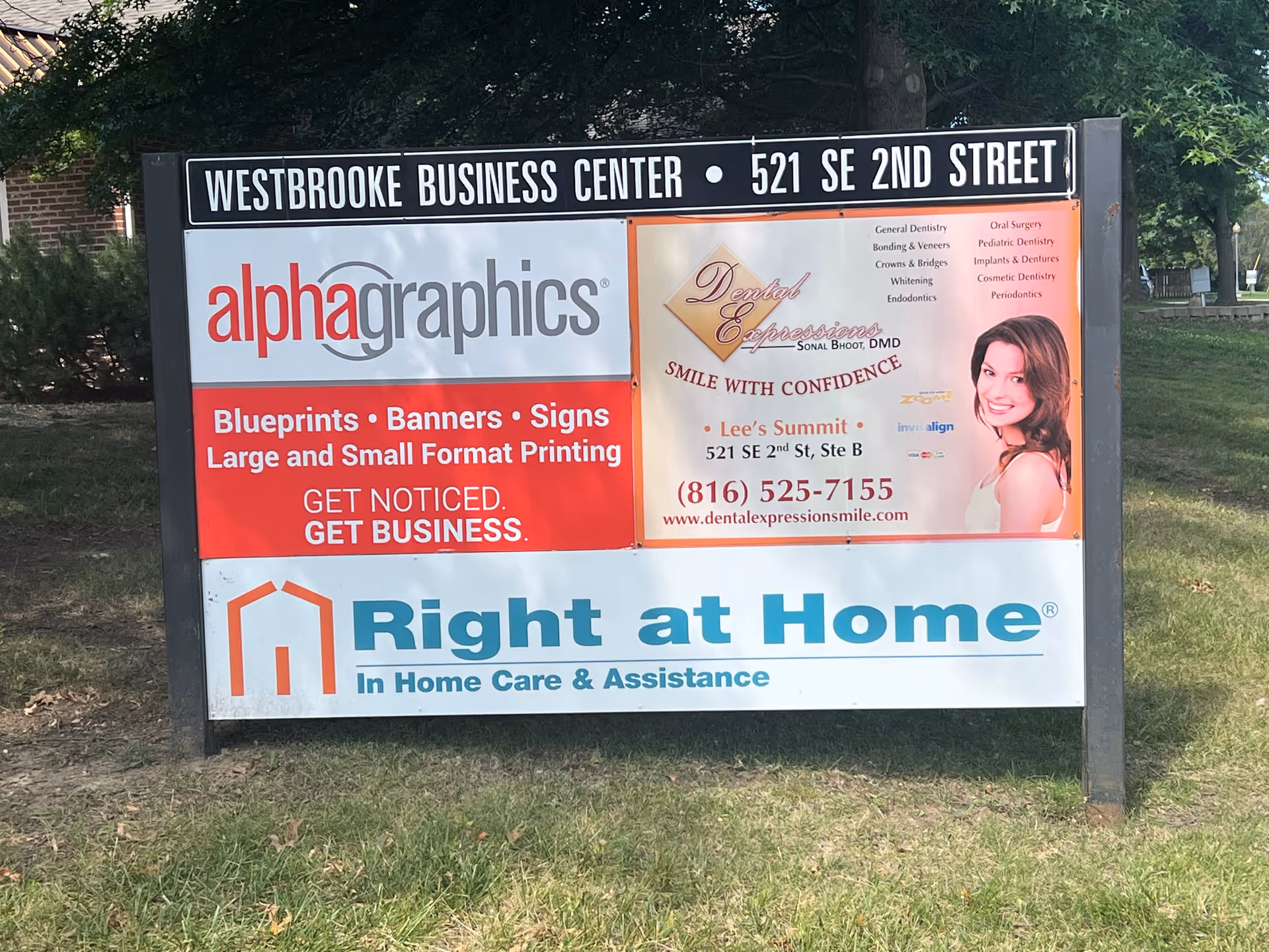 Outdoor signboard on grass advertising Right at Home and local services.