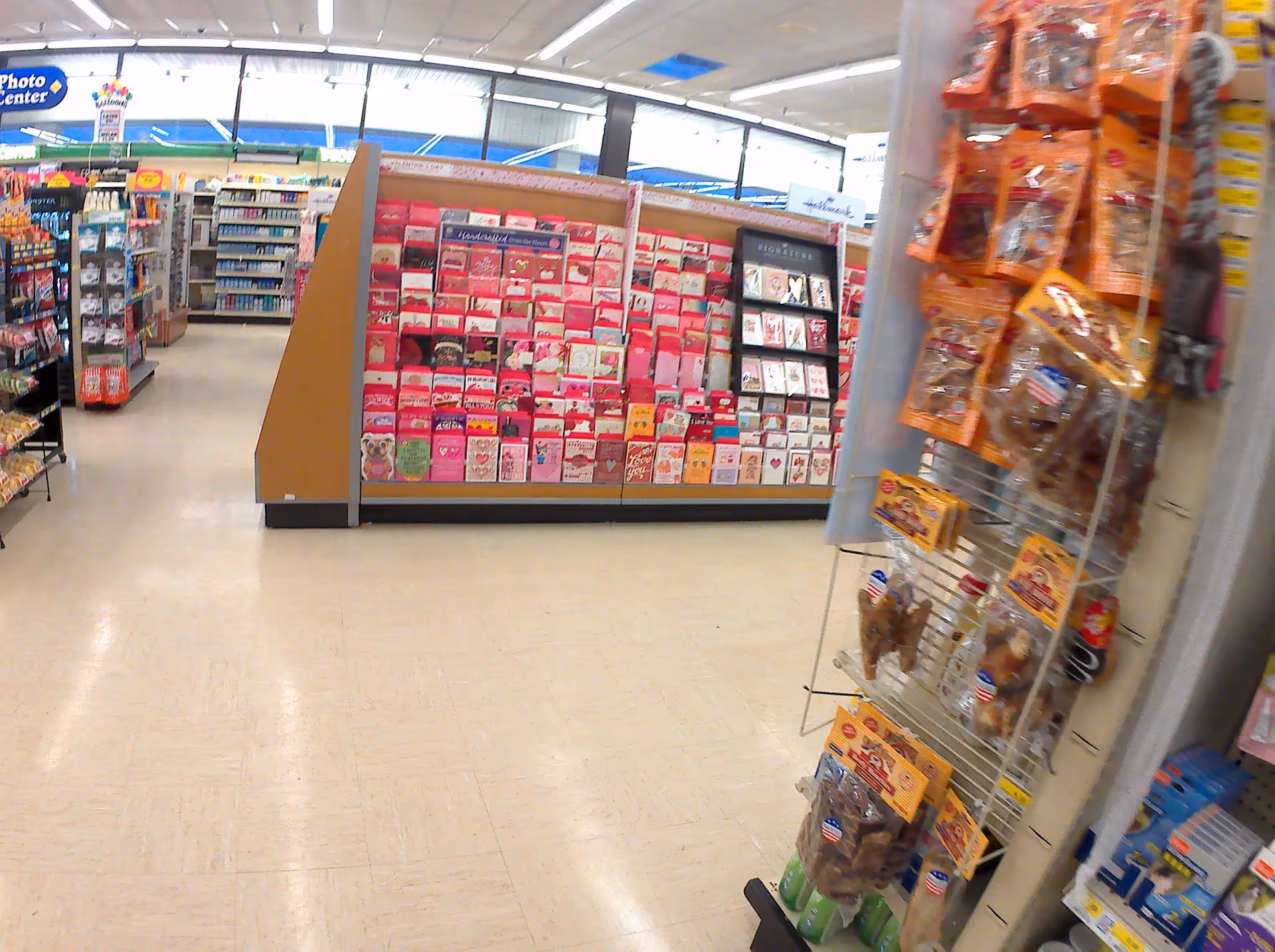 Interior view of Discount Drug Mart with greeting card display and product shelves.